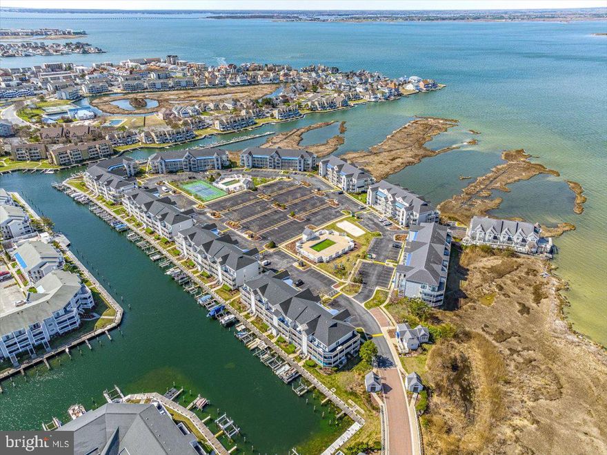 This is the bayfront condo you’ve been waiting for in one of the best locations of The Island at Hidden Harbour! Located directly on the bay with panoramic views of the sunsets and Northside Park fireworks, this unit is turn-key and ready for immediate enjoyment with LVP flooring, a coastal white kitchen with granite countertops, stainless-steel appliances, a gas fireplace, plantation shutters, and an open concept floor plan that maximizes your water views. The spacious master suite boasts an en-suite bath and a walk-in closet. The guest bedroom is a great size and has easy access to the full guest bath. Relax on the spacious balcony with unobstructed views of the bay. Your balcony also comes with a large storage closet, great for keeping your beach toys. The community of The Island at Hidden Harbour is a hidden gem in Ocean City, where you can easily access all of the main beach attractions while being tucked away in a quiet and peaceful waterfront community. The amenities include two pools, tennis court, beach volleyball court, and children’s playground area. There are also boat slips available for rent, so you can enjoy your time out on the water. This location is superb, being just a few blocks to the beach, easy walking distance to popular restaurants and attractions, and within very easy walking distance of Northside Park, which offers walking trails, bayfront pier, sports courts, movie nights, grand firework shows (and you have a front row seat from your private balcony!), and numerous different indoor and outdoor sports courts. This condo has been well loved and maintained, and is offered fully furnished! Schedule your private tour today before this unit leaves the market!
