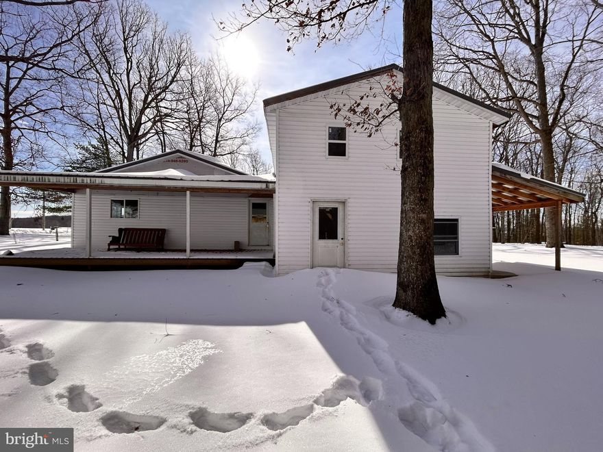 Plenty of potential awaits you in this renovation opportunity. Inside has been started and just needs your finishing touches. New roof, windows and flooring in the spacious first floor rooms. Upstairs are 2 large bedroom areas ready for finishing, another bedroom area is on the first  floor. Well and septic are in place and electricity is at the road. Two cozy porches for enjoying the sunshine. Detached garage large enough for two cars and extra space for workshop or storage. Bring your hammer and ideas!