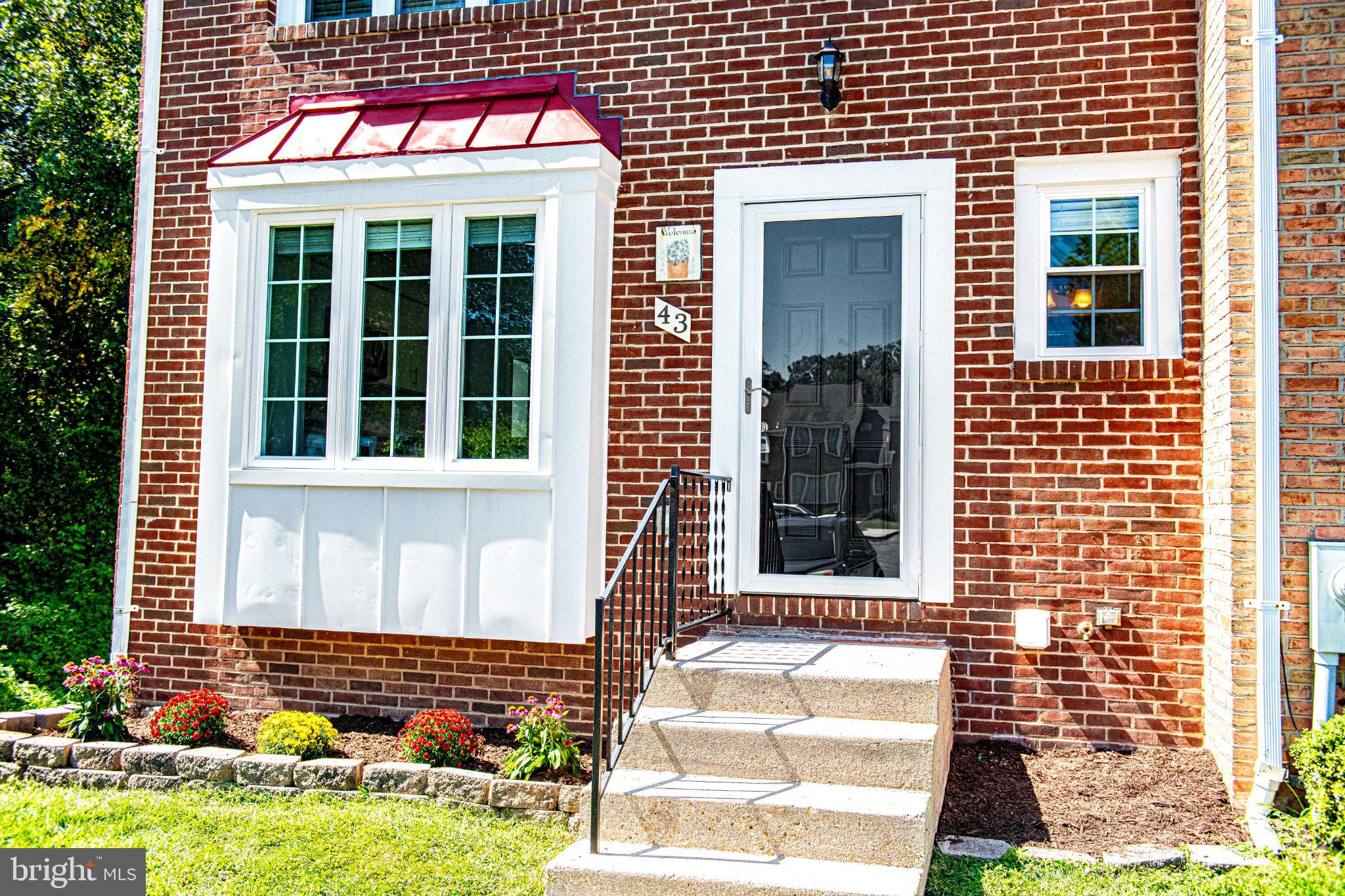 Nestled in the prestigious Millbrook community, this exquisite end-of-row townhouse offers a harmonious blend of traditional charm and modern elegance. This residence boasts a stunning brick front that exudes timeless appeal. Step inside to discover a thoughtfully designed layout featuring three spacious bedrooms and two and a half luxurious bathrooms, perfect for both relaxation and entertaining.
The heart of the home is adorned with luxury vinyl plank flooring that flows seamlessly throughout the main living areas, creating an inviting atmosphere. The cozy yet sophisticated ambiance is enhanced by plush carpeting in the bedrooms, providing a warm retreat at the end of the day. Recent updates to the kitchen elevate the space with a fresh, modern touch—ideal for the home chef or casual entertaining.
Step outside to enjoy a newly added deck with stairs leading to the backyard, perfect for outdoor dining, morning coffee, or hosting gatherings. The walkout basement features a custom bar, making the lower level a standout space for entertaining or relaxing. Whether you envision a home gym, a media room, or a serene office space, the lower level offers endless possibilities.
Enjoy the convenience of ample parking in the dedicated lot, ensuring that your guests feel welcomed. Outside, the property is surrounded by lush greenery, offering a peaceful escape from the hustle and bustle of daily life. The community’s charm and tranquility provide a perfect backdrop for outdoor gatherings and leisurely strolls.
This residence is not just a home; it’s a lifestyle. Experience the perfect blend of comfort, elegance, and community in this remarkable Millbrook townhouse, where every detail—from the updated kitchen to the entertainer’s bar—has been crafted for your enjoyment. Embrace the opportunity to make this exquisite property your own and indulge in the luxury of living well.
