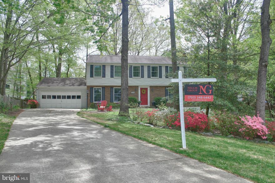 Premium 1/3 acre lot, 5 BR retreat in sought-after Montclair, walking distance to beach. Quietly tucked away with a long driveway on a cul-de-sac surrounded by mature trees. Gourmet kitchen with stainless steel and granite.  Hardwood floors, wood fireplace, remodeled bathrooms. Finished basement with plenty of room for play, plus a storage room and bonus room. New HVAC 2011, Anderson windows 2010.