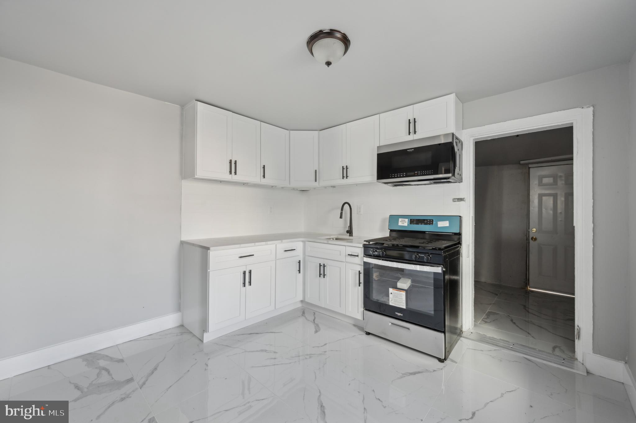 This charming twin home boasts a newly updated white kitchen, making it the perfect choice for first-time buyers or a great rental opportunity for investors looking to expand their portfolio. Enter through the inviting covered front porch and step into a spacious living room and dining room combo, an ideal space for gathering with friends and family.
At the back of the home is the modern, enclosed eat-in kitchen, which features a convenient passthrough window. This updated kitchen is perfect for both cooking and entertaining, offering a brand-new stove, built-in microwave, fresh white cabinetry, and sleek granite countertops. Whether you're preparing family recipes or experimenting with new ones, this kitchen provides the perfect setting.
Beyond the kitchen is a laundry room with washer and dryer hookups and access to the expansive backyard. Both the kitchen and laundry room showcase brand-new white tiled floors. Throughout the upper and main levels, you'll find new luxury vinyl flooring that adds a touch of elegance.
The property also includes a large front porch, a spacious front yard, and a generous backyard that is rarely seen in the city, offering plenty of room for outdoor activities, gardening, grilling, and relaxation during the warmer months. The full-size unfinished basement provides ample storage space to meet your needs.
Located just minutes from I-76 and within easy reach of public transportation routes 10, 15, and 52, this home is conveniently situated near Lancaster Ave and Lansdowne Ave, providing easy access to all the essentials.