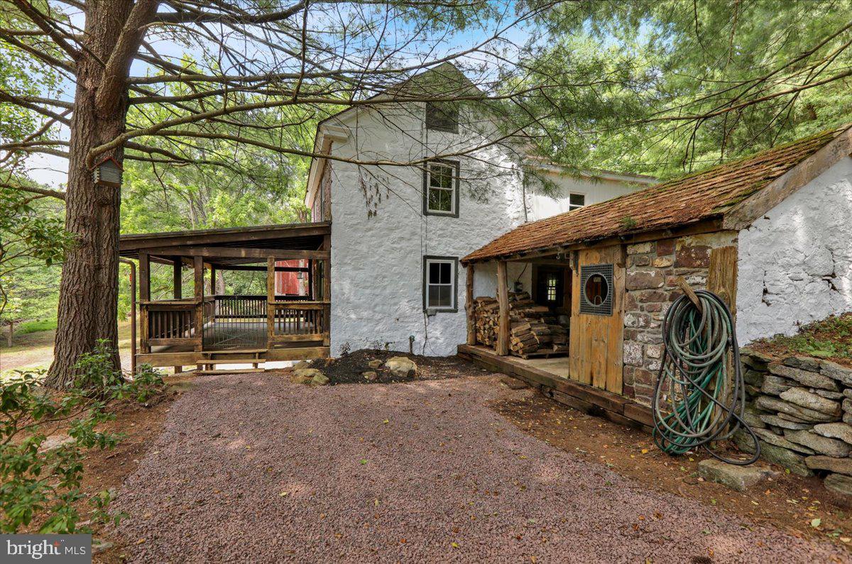 Nestled in a tranquil and private setting within the desirable Twin Valley School District, this well maintained 1830 stone farmhouse offers a rare blend of historic charm and thoughtful modern updates. Set on a picturesque parcel, the property provides an ideal country retreat while remaining conveniently located to nearby amenities. This 3-bedroom, 1-bath residence showcases timeless craftsmanship with its original stone construction, wide plank flooring, and a classic wood-burning fireplace that adds warmth and character to the main living area. The expansive outdoor living space, complete with a patio equipped with an outdoor kitchen, is ideal for entertaining or relaxing in a peaceful, natural setting. Additional structures include a detached garage, a large barn, and two versatile storage sheds, offering ample space for equipment, workshops, or hobby farming. Whether you’re seeking a full-time residence or a country getaway, this historic stone farmhouse offers privacy, charm, and practical updates—all set in a beautiful rural landscape. Schedule your showing today.