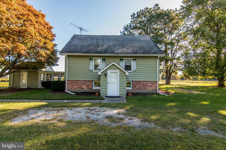 Originally built as a Potato Barn in 1920, this home is full of charm and character. As you step down to the main level, you are greeted by the original brick fireplace, brick floors, and exposed beams. Off the kitchen is a four-season sunroom and private laundry/utility room. Upstairs there are 3 bedrooms and a fully renovated full bath. The floors are original pine planking that were refinished by the seller. There is also a fully floored walk-up attic for all of your storage needs. This 1440 square foot home includes 720 sq ft above grade, and 720 sq ft partially below grade.  Septic has been pre-inspected with minor repairs already completed. This truly is a unique property so come quickly with your decorating ideas.