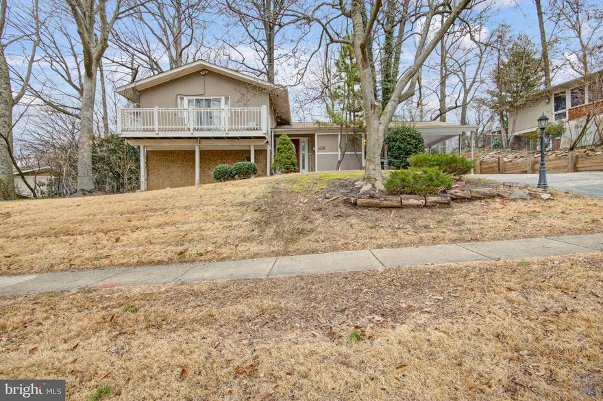 Step into the idyllic Silver Spring neighborhood and into a home that is full of mid-century charm yet updated with the original hardwood throughout much of the living space. New energy efficient dishwasher & W/D, new water heater in 2021, and new roof in 2018. This split level home wows on every level – to the fully updated bathrooms and beautiful wood burning fireplace on the mid-level to the slate patio in a shaded backyard, be on the lookout for the deer that call Hillandale home! Gorgeous, main level open floor plan with granite eat-in kitchen, wood floors, large mud room and wall of windows overlooking the spectacular yard and stone patio. Expanded Owners Suite includes private balcony, walk-in shower & double vanity in the bath. 2 additional bedrooms  upstairs  & 1 on the mid level. All bathrooms updated with granite countertops. <1 mile to FDA and downtown Silver Spring!