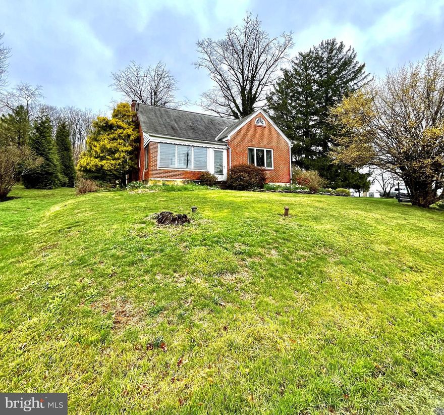 Welcome to your new haven in the heart of Boyertown Berks County. This cozy brick cape is loaded with robust, nostalgic charm, including an eat-in kitchen, plaster walls, era radiators, arched doorways, and original hardwood floors. A perfect blend of vintage and convenience with close proximity to recreation, shopping, parks, and easy access to major highways. Enjoy relaxing in an enclosed, front-heated porch while admiring the scenic countryside views, or plant your garden in the sprawling backyard with a potting shed.
The main level features two bedrooms, a spacious living room, a remodeled bathroom, and a large kitchen. The upper-level bedroom has unique slanted ceilings, offering creative design and storage solutions opportunities. The lower-level unfinished basement has a wood-burning stove and direct access to the one-car garage. Don't miss this opportunity to bring your personal touches to make this your forever abode. The sale/purchase also includes a 0.33-acre adjacent vacant lot/parcel! This rare find will not last long.