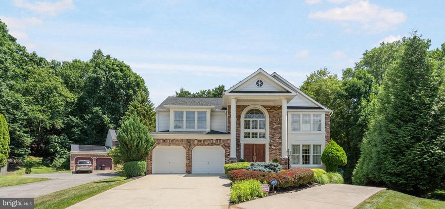 Enjoy many upgrades, modern amenities & exceptional classic design in this beautiful home! As you enter through the grand double doors, you're greeted by elegant hardwood floors and a beautiful staircase in the spacious entryway, setting the tone for luxury and comfort throughout. Entertain guests in style in the expansive formal living room and host memorable dinners in the connected formal dining room, ideal for gatherings and special occasions. The family room is a cozy retreat, centered around a stunning marble fireplace that adds warmth and character to the space. The gourmet kitchen is a chef's dream, overlooking the family room and offering plenty of cabinet and prep space, complemented by granite flooring and countertops that flow seamlessly up to create a perfect backsplash. The island features a stovetop, extra counter space, and a lower level for additional seating, making it a hub for culinary creativity and socializing. A convenient half bath completes the main level. Upstairs, escape to the luxurious primary bedroom suite, complete with a charming fireplace, generous space, and an ensuite bathroom designed for relaxation. The primary bathroom features a large Jacuzzi tub, dual vanities, and a tiled stall shower, offering a spa-like experience at home. Three more spacious bedrooms on this level share a full bath conveniently located in the hallway. The lower level is an entertainer's paradise or the perfect space for in laws or an au pair with it
s private entrance. Featuring a large finished living area with built-in bookshelves, another fireplace, porcelain floors and a secondary kitchen with a half bath for added convenience. A fifth bedroom with its own fireplace, ample storage, and 2 newly installed egress windows enhance safety and natural light in the basement. A full bathroom featuring a stall shower completes this level. Step outside to the expansive backyard, your private oasis perfect for relaxing and entertaining throughout the summer. Enjoy gatherings on the spacious raised deck off the family room or cozy up around a fire on the patio. Located near major highways such as 695 and 795, Mill Station Shopping Center and Northwest Regional Park, this home offers both convenience and access to a variety of amenities including restaurants, shopping, parks, and golf courses. Updates on the house include the roof, which was replaced in 2015 with a 60 year warranty, water heater in 2019, furnace, basement windows and kitchen cabinets as well as the deck were just redone in 2023.  Schedule your showing today and envision the possibilities of living in luxury and comfort in this home!