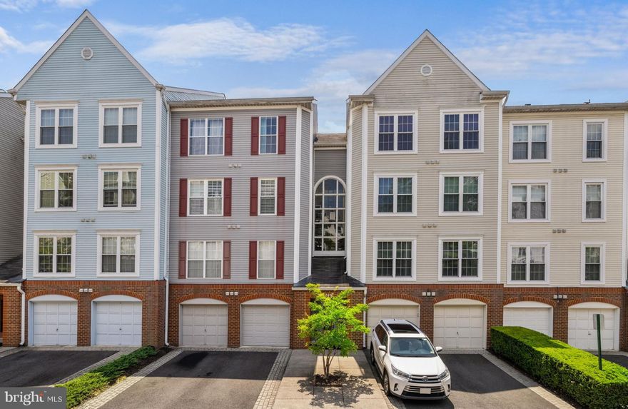 OPEN HOUSECANCELED .  Fabulous sun filled condo with 2 assigned parking spots. This immaculate home offers a modern and open floor plan with many unique decorator touches throughout.  Features include;  9 foot ceilings, dramatic dark wood flooring on main level, foyer, hallway and one bedroom,  open kitchen with breakfast bar w/ gorgeous quartz counter tops, tile backsplash, deep trough sink and  stainless steel appliances, windows replaced, spacious primary suite with walk-in closet with organizers and an elegant chandelier, renovated primary bath with double sinks and separate tub and shower,  wood burning fireplace with  custom quartzite stacked stone surround, renovated full hall bath, new water heater 2020,  light fixtures replaced, sliding barn style door hiding the washer and dryer,  private covered balcony  and more.  Hillwood is located in a vibrant community that is within walking distance to shopping, bars, restaurants and the metro.