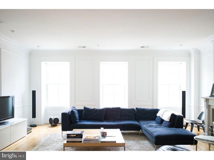 This rare and sophisticated 2637 square foot condo (plus approx. 400 square foot private deck) is wrapped in natural light and offers grand-scaled rooms, a sprawling 3BR layout, and superb architectural details throughout. Step off the key-locked elevator to a dramatic foyer which leads to an expansive Living/Dining room with high ceilings, classic moldings, and gorgeous wood floors throughout.   Beyond the Living room, you'll find the large windowed Eat-in-Kitchen, Italian cabinetry and Meile appliances, ideal for enjoying casual meals or staging memorable dinner parties. Take the classic staircase to your own private deck large enough for small outdoor dinner parties.  A few steps down you'll find the enormous Master Bedroom Suite, a pin-drop quiet sanctuary featuring a separate dressing area with custom fitted closets, and a fabulous no expense spared Waterworks bathroom complete with double sinks, a glass-enclosed rain shower, and a deep soaking tub.  There is an adjacent office/den also with high ceilings and a large window.   Nearby, a separate hallway leads to two tranquil guest bedrooms each with fully fitted closets, and a classic marble-tiled bathroom. Additional amenities include bonus room, multi-zoned central air-conditioning, a laundry with Meile washer-dryer, Lutron lighting on dimmers, and a tasteful powder room for guests. All this, in a small 6-unit boutique condominium in prime Rittenhouse Sq with key-locked elevator, video intercom security, and attractively low monthly charges.  Built in 1860 in the French Renaissance style, the stately 5-story stone building sits elegantly at the on Spruce Street and is in close proximity to the neighborhood's best restaurants, cafes, boutiques, cutting edge design stores, and all major transportation. Enjoy style, comfort and convenience right in the heart of Philadelphia's most sought-after zip code! Parking included for 1 year at a nearby garage with acceptable offer.