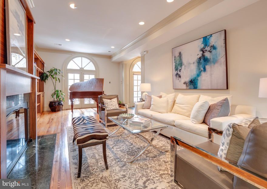 DRASTIC PRICE REDUCTION!  MOTIVATED SELLER.  WIDE & TALL in super-prime Capitol  Hill location!  Nearly 5000 square feet spread out over 4 extra-wide (38 feet, in fact) levels.  Excellent layout for gatherings large or small.  Chef's kitchen with east-facing bay window and breakfast banquette.  Seamless transition from living space to expansive rear deck and garden.  Park your car in the garage and you're one flight of stairs to your living space.  Unheard of!  Generous storage throughout.  Four bedrooms plus two full bathrooms on the second floor.  The master bedroom suite that dreams are made of occupies the entire top floor.  Your friends will have closet envy!  A lovely one bedroom apartment (for rental?  Au pair?  In laws?) on the lower level offers an open plan living area with a fireplace plus a front and rear patio.  Say arrivederci to the dark house blues and let there be light!   View 3D Tour here: https://my.matterport.com/show/?m=MQL46q7Pjy4