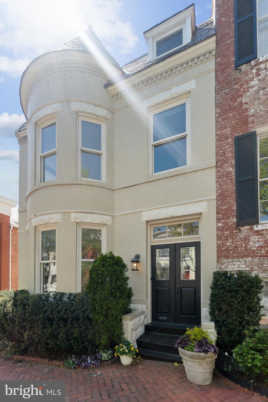 A timeless residence in prime Georgetown! Nestled in Georgetown’s coveted East Village, this distinguished 19th-century semi-detached row home is a masterful blend of historic grandeur and contemporary ease. Spanning nearly 5,000 square feet across four levels, the residence offers five bedrooms, four and a half baths, and offers a sensible and spacious floor plan throughout. Original hardwood floors, restored fireplaces, and graciously proportioned living areas pay homage to the home’s historic details, while contemporary updates bring effortless luxury. The chef’s kitchen is designed to entertain, featuring granite countertops, large center island,  and commercial-grade stainless steel appliances. Spa-inspired bathrooms are enjoyed throughout, including the updated primary bath featuring a soaking tub and marble tile shower. Outdoor living is equally as gracious, with a screened-in porch, an expansive deck, and a rare attached two-car garage. Additional conveniences include a full lower level with family room, guest suite with sauna, and an abundance of storage including a cedar closet.