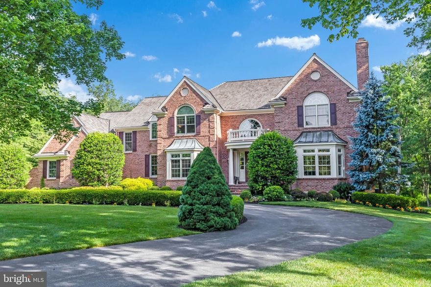 Proudly Nestled on 3.95 acres on a quiet cul-de-sac which provides ultimate luxury and tranquility to this remarkable estate in the Great Valley School District. Exquisite design meets modern luxury with tasteful and timeless updates made throughout this exclusive retreat. A wraparound driveway escorts you home to a lovely brick front facade and new Hardie siding that hugs the exterior for the most charming and delightful curb appeal. A stone walkway and Mahogany front door open to a grand foyer laid with hardwood flooring and features a Palladian window and tall ceilings that provide soaring open space and striking natural light that draws your attention to the curved staircase. To the right of the foyer, the living room boasts crown molding, site finished hardwood floors, a magnificent window to showcase a gorgeous Steinway piano (negotiable), elegant wainscoting and crown moldings, and a gas fireplace encapsulated by an elegant mantle. To the right of the foyer, the formal dining room creates the perfect space to host dinners for your most important guests. Tasteful wainscoting and crown molding embraces the room in style while hardwood continues to grace the floors.  An adjoining Butler’s Pantry transitions into a gorgeous gourmet eat-in kitchen carefully thought out with the entertainer in mind with a huge center island, abundant custom cabinetry, two sinks, Wolf 48” gas range, granite countertops, 48” subzero refrigerator, 2 refrigerator drawers, 2 dishwashers built in espresso machine, and a custom walk in pantry closet. To help keep things tidy, the tiled mudroom area just off the kitchen includes a powder room, a separate laundry room with storage, built in cubbies, large coat closet, rear staircase, extra storage and access to the 3 car garage.  The family room, offers tall cathedral vaulted ceilings with lots of windows and featuring a stone gas fireplace for ambiance, and opens to the sun room that overlooks the your scenic backyard.  Tucked back for additional privacy is the full paneled library and a formal powder room.  For your own secluded retreat, the primary suite on the second floor is a luxurious escape that offers a warm but spacious bedroom, another sun/sitting room that shares a double sided gas fireplace. The primary ensuite continues with his and hers large walk-in closets, a bathroom with a toilet room, two vanities, a luxurious soaking tub, a walk-in tile shower and tile flooring - the ultimate spa-like hideaway. Completing the second floor, you will find 4 more generously sized bedrooms (one with vaulted ceilings and Palladian window) each with their own full bathroom, giving each guest their own taste of luxury. 
The finished basement is an entertainer’s dream with a pool table room featuring a wet bar that includes refrigeration, a sink, custom cabinetry and unique stone countertops and a beautiful triple glass door wine cellar for the collector. The basement also has two lounges - one with a fireplace for poker games or playing pool, and a second that can be used as a theater room - two additional guest bedrooms, a full bathroom, sauna room, and doors to the rear yard. For outdoor entertaining, you’ll enjoy the beautiful stone terraces with outdoor kitchen and a pergola covered seating area with stone fireplace, which overlook the tranquil backyard with an In-ground Pool and Spa. So many additional surprises await your upon your visit. While you are tucked away in the serenity of Willistown, you are also centrally located with easy access to the turnpike, corporate centers, several shopping centers and other great amenities of walking trails, a new recreation center, and be a part of an award winning school district. Luxury can be yours! Schedule an exclusive private tour of this lovely estate.