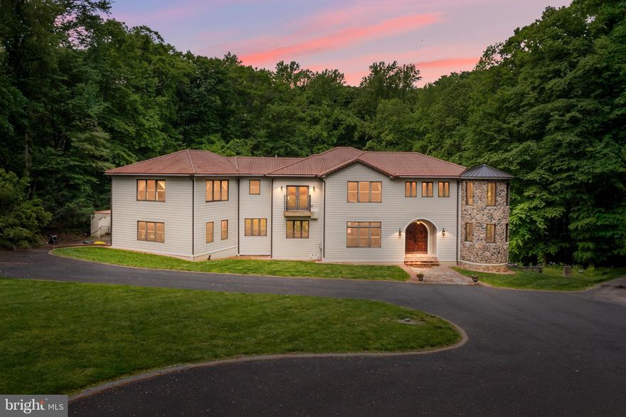 Welcome to 915 Mitchell Farm Lane. Situated at the end of a cul-de-sac on 2 acres of spectacular secluded grounds offering peaceful privacy in award-winning Unionville Chadds Ford School district. Indulge in the epitome of modern luxury living with this completely rebuilt, Mediterranean style 6,000+ sq.ft., five-bedroom residence offering a unique blend of indoor and outdoor entertaining at its finest. Bask in the tranquility of the lush grounds on the expansive two-tier back deck with a covered dining area overlooking the swimming pool and architectural landscaping wall, meticulously landscaped shrubs, and steps that lead down to a quaint pond. Entering the home you are greeted by a foyer area that leads directly into the expansive main living area that combines the family room with a gorgeous stone fireplace, formal dining, and a sun-filled, beautifully preserved silo that spans 2 floors of surrounding windows. The gourmet chef’s kitchen is complete with custom white cabinetry, an eight-burner stove with a hooded vent, a double oven, a beverage fridge, granite countertops, and an elevated bar for seating. The butler’s pantry adds to the convenience of a modern lifestyle. A guest bedroom is also located on the main floor overlooking the pool. Three more expansive bedrooms with en-suite baths are located on the second floor. The main suite has a large attached sitting/office area, a walk-in closet, and a spa-like bath. The lower level offers another area of luxurious living complete with a bar, den with fireplace, heated floors, and a fifth bedroom with bath. The property features a 2-car attached garage and many modern upgrades suited for luxury living. The pride of ownership is prominent throughout this wonderful home perched on secluded grounds that back up to the Brandywine Conservatory and still close enough to major roadways, shopping, and restaurants. Schedule your showing today to see this truly unique home for yourself.