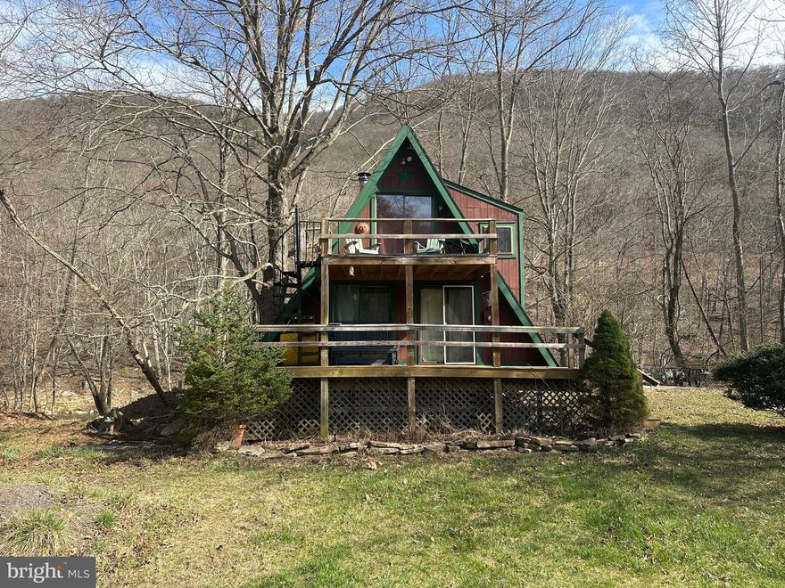 WATERFRONT OASIS! Come check out this wonderful river front A frame style cabin in Great Cacapon! This is a 1 bedroom 1 bathroom A Frame style cabin on the Cacapon River. The home also has a great loft area with plenty off room to make it what you want, it’s currently set up as a bedroom. Come sit on the back deck and listen to the river or stay inside next to the wonderful woodstove. Storage shed also on the property to store all you kayaks and tubes for the river! This is the waterfront cabin you have been looking for! I have a feeling this one wont last long so come check it out today!