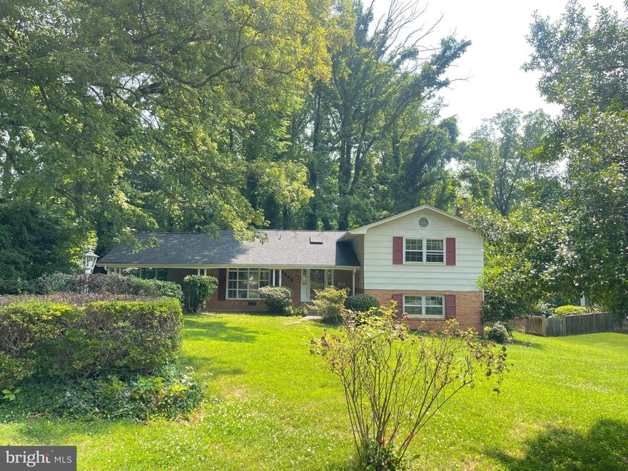 Don’t miss your chance to own a spacious split-level home on a beautiful 0.46-acre lot backing to serene, mature trees. Located in the desirable Tall Oaks neighborhood, this home offers the perfect blend of space, potential, and prime location — priced under market for immediate value. Step inside to a bright and open main level, featuring two skylights and large windows that fill the living and kitchen areas with natural light and tranquil backyard views with patio.  Upstairs, you'll find 3 bedrooms and 2 full baths, offering plenty of space for comfortable living. The finished lower level adds incredible versatility, featuring a large family/recreation room with a cozy fireplace, a third full bath, utility room, and ample storage. Ideal for a home office, in-law suite.Approx. 2,312total finished sq ft,1,520 sq ft main & upper levels,792 sq ft finished lower level, One-car carport, Huse storage ,New roof installed April 2025
**Sold strictly As-Is – ideal for buyers looking to renovate and build equity or for investors seeking a strong value-add opportunity. All this in a prime commuter location near I-495, I-395, I-66,!-95  and just minutes to Amazon HQ2, Washington, DC, Tysons, shopping, and dining. Incredible potential at a price below market — schedule your tour today!