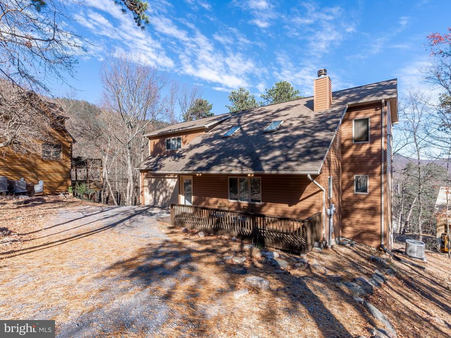 Perfectly appointed short-term rental property ready for a new investor owner. Fully equipped with everything you need, from major appliances & attractive furnishings, to bedding, linens, electronics, books & games. The 4-bed 3.5 bath home features a semi-open floor plan with gas fireplace, vaulted ceiling, and a spacious deck out back, recently reinforced and ready for you to add your hot tub! The garage has been completely finished into a fun game room with its own heating and cooling. The 2nd level includes a large master bedroom with two guest bedrooms and second full bath. The attractively finished basement includes a rec-room with access to the lower deck, as well as another bedroom and full bath. Located near the ski slopes, outdoor pool, tennis, hiking and more. Perfect location!