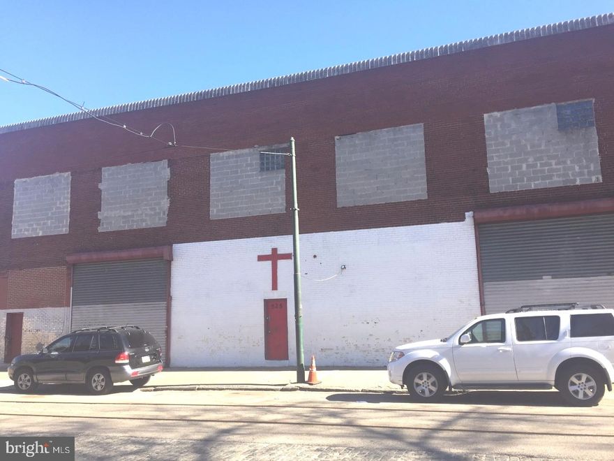 VERY MOTIVATED -- He is ready for this property to move!  This expansive warehouse, garage is being sold AS_IS condition.  Owner will remove all interiors and deliver property empty to new owner IF REQUESTED.  Great development opportunity!     Upon entering the main door, there is a conference room to the right w/a half bath.  To the left is a small office with a full bathroom.  Access to the warehouse level is on the main level.  Stairs to the upper level lead you to a one bedroom apartment, complete with a living area, full bathroom w/tub, kitchen and laundry area.    This unique property overall offers 2.5 baths and the ability to live on-site during renovation.    A blank slate with immense potential for any developer or since the lot size allows, complete demo to rebuild, offers the developer/builder limitless potential.  The main level to warehouse has 2 drive-in docks and an exterior concrete wall surrounding the warehouse, offering plenty of space for 10+ cars or expansion opportunities.      ZONING-- There was conflicting information about the zoning but it has now been verified that it is officially RM1.  NOT included: crs, trucks, tools/machines, personal items and scaffolding.,The 12,448 interior sq. ft. does NOT include the exterior drive in space that is enclosed by a concrete L-Shaped wall; If you view the top view picture, it is an L-SHAPE to the left of the warehouse and can easily fit 10-15 cars and is also part of the space.  Please take that into account for the overall space.