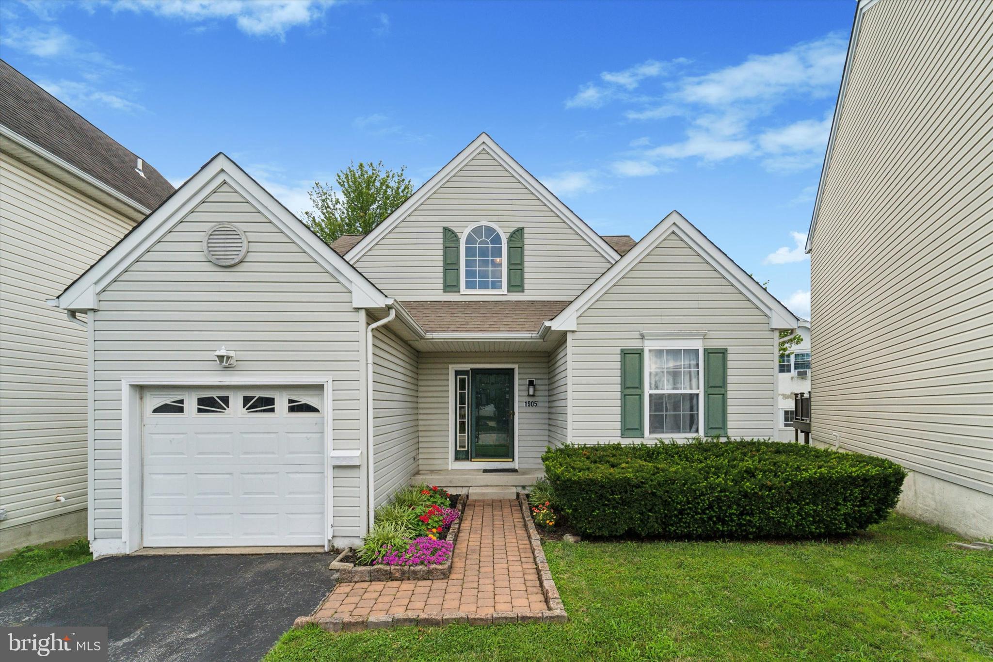 Nestled in the peaceful Siters Square neighborhood on a quiet cul-de-sac, this home offers comfort and functionality. This spacious residence features a first-floor primary bedroom complete with a walk-in closet and an en-suite bath with a Jacuzzi tub.
The first floor also includes a versatile office that can serve as an additional bedroom, a powder room, and the convenience of a laundry chute to the basement. Hardwood floors welcome you into the home in the entryway.
Upstairs, you'll find two generously sized bedrooms and a loft-style sitting area that overlooks the foyer—ideal for reading, relaxing, or additional work-from-home space.
Step through French doors onto the elevated back deck, offering a private space. The finished basement provides even more living space, perfect for a recreation room, gym, or media area.