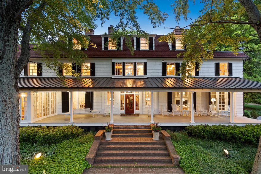 Located in the highly sought after golf course community of Greenspring Valley Hunt Club, this idyllic hilltop estate offers both total privacy and an oasis of serenity. Situated on over 7 acres, turn of the century craftsmanship is blended with modern updates to create an unparalleled property. An expansive front porch that belongs in Southern Living immediately beckons you upon arrival. First floor spaces are grand in proportion and ideal for entertaining, yet remain inviting and purposeful for family use. Stately historic detailed moldings, fireplace mantles, and intricate trim work cannot be replicated. Flooded with natural light throughout. A generously sized kitchen and spacious adjoining family room will be your daily hub. A wrap-around porch just off the kitchen is sure to be the preferred dining destination on beautiful evenings. On rainy days, curl up with a book and coffee on the enclosed porch surrounded by french doors. The cozy mahogany paneled library has a connecting office and en suite half bath. Upstairs the primary suite offers two bathrooms and two closets. The spacious bathrooms are ready for your vision; bring your designer with fresh ideas and make them your own. The amount of closet space will bring sheer joy to even the most prolific of fashionistas. The jewel of the property is most certainly the reimagined carriage house. Masterfully designed, it is incomparable in detail and construction. Reclaimed lumber floors. Wood burning stone fireplace. A gym, indoor sports court, wet bar, golf simulator and putting green. Welcome to your own on property retreat. For even more activity space retreat to the main house lower level theater or the outdoor sports court. This tranquil property is conveniently located in easy proximity to shopping, restaurants, 695, and many of the areas most desirable schools. Come make it your own.