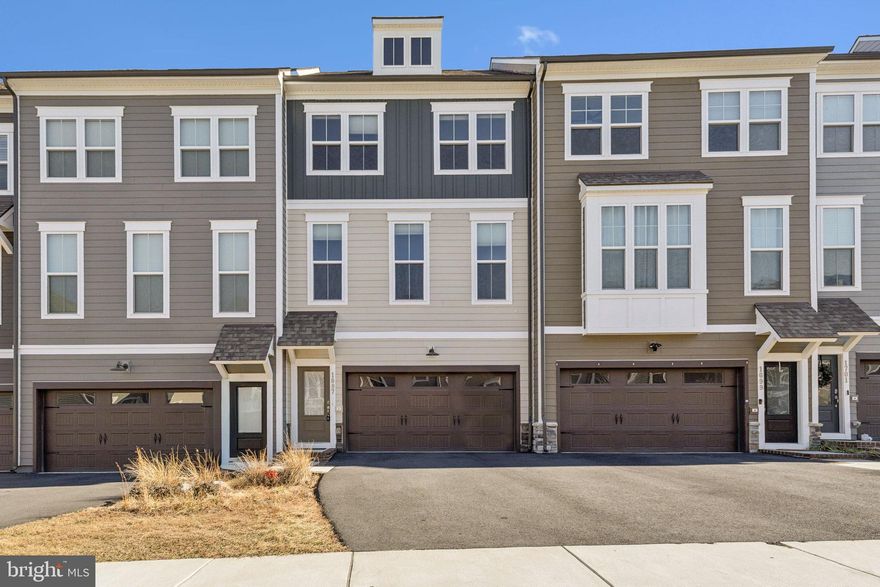 Exceptional Opportunity: Elegantly Designed Townhome in the Coveted Potomac Shores Community

Presenting an exquisite three-bedroom townhome with a two-car, front-load garage, ideally situated within the prestigious Potomac Shores Community. Constructed in 2022, this residence features a luminous, open-concept floor plan, meticulously designed to enhance modern living.

Interior Highlights:
The gourmet kitchen is a standout, boasting a spacious sit-down island, complemented by upgraded white cabinetry, elegant white quartz countertops, and high-end stainless steel appliances. The main level is adorned with luxurious LVP flooring, seamlessly connecting the expansive family room and the distinctive dining area—an inviting environment for relaxation and social gatherings. 

Step onto the deck to relish the invigorating outdoor air, perfect for entertaining guests or indulging in peaceful moments. Ascend to the second level, where the primary suite awaits, complete with an exquisite upgraded private en suite bath and an expansive walk-in closet, promising a sanctuary for unwinding after a long day. Additionally, two well-proportioned bedrooms and a guest bathroom are located down the hall, along with a conveniently positioned laundry room.

The lower level promises versatility with its ample open space, also featuring LVP flooring and direct access to the backyard. This area can effortlessly transform into a private home office, an additional guest suite with a full bath, or a delightful den for enjoying leisure activities.

Community Amenities:
Residents benefit from a multitude of community amenities covered by HOA fees, including high-speed Verizon FIOS internet, refuse removal, access to multiple pools, a clubhouse, and a fitness center. Embrace an active lifestyle with hiking and biking trails, multipurpose sports courts, and the prestigious Jack Nicklaus Signature golf course.

Prime Location:
Strategically located for ultimate convenience, this residence offers easy access to I-95, US-1, and Quantico, with a forthcoming VRE station expected to be less than half a mile away.