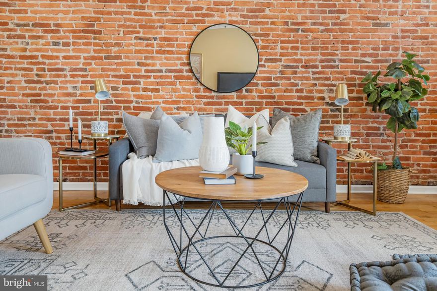 Nestled in the heart of Canton, this expansive and breathtaking end-of-group row house is a true gem, offering a wealth of amenities and an abundance of natural light. With approximately 1,850 square feet of living space, this home boasts three bedrooms and three-and-a-half bathrooms, providing ample room for comfortable living.

Upon entering the main floor, you'll be greeted by a primary bedroom complete with an en-suite bathroom, creating an oasis of relaxation and convenience. The main level also features an abundance of charm, highlighted by exposed brick walls that lend character to the space. Elegant details such as recessed lighting, crown molding, and chair rail further enhance the ambiance. The kitchen is a chef's dream, equipped with stainless steel appliances and granite countertops, offering both style and functionality. A beautifully tiled bath adds a touch of luxury to everyday living. The open chair staircase and decorative fireplace add to the overall allure of this residence.

As you ascend to the upper level, you'll discover two additional bedrooms, each showcasing exposed brick walls and a vaulted ceiling that creates an inviting and airy atmosphere. Tiled baths on this level maintain the home's commitment to quality and style. The real treasure awaits on the rooftop deck, where you can unwind and enjoy picturesque views of the surrounding area.

Conveniently located just 160 steps away from Canton Square, this property invites you to explore a vibrant neighborhood known for its bar hopping opportunities and fine dining experiences. For those who appreciate waterfront living, the Canton waterfront is a mere three blocks away, offering serene moments by the water's edge. Commuters will appreciate the home's proximity to major transportation arteries, including I-95 and I-895. Additionally, the esteemed Johns Hopkins University is just a short drive away, making this location ideal for professionals and students alike. Don't miss the chance to make this remarkable Canton residence your own.