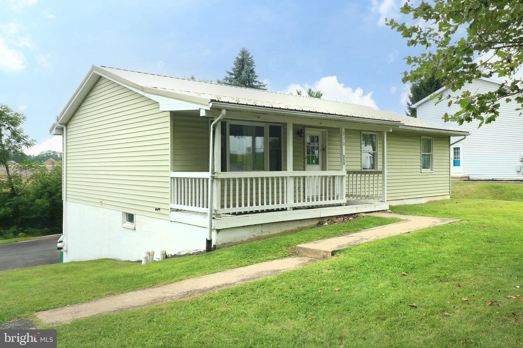 One floor living with a one bedroom basement apartment in Lemont! Use the lower level walk-out apartment to supplement your mortgage payment, as a space for a college student, or as a terrific guest quarters. This four bedroom, three bath ranch home features a front porch, solid surface flooring on the main floor, a one car garage, and a metal roof. The living room and combination kitchen and dining room are large spaces and have ample natural light, while the primary bedroom has it's own ensuite bath. With plenty of natural light and large living areas, the basement apartment is a nice space. Also in the basement is a laundry/mechanical room, which can be shared with the apartment space or not, and a one car garage. Additional features include radon mitigation, a water softener, a newer water heater, several ceiling fans, and a rental permit for the apartment. Not far from the restaurants and coffee shop in the Village of Lemont and close to hiking on Mt. Nittany, plus a short drive to the mall area, downtown State College, and Penn State University.