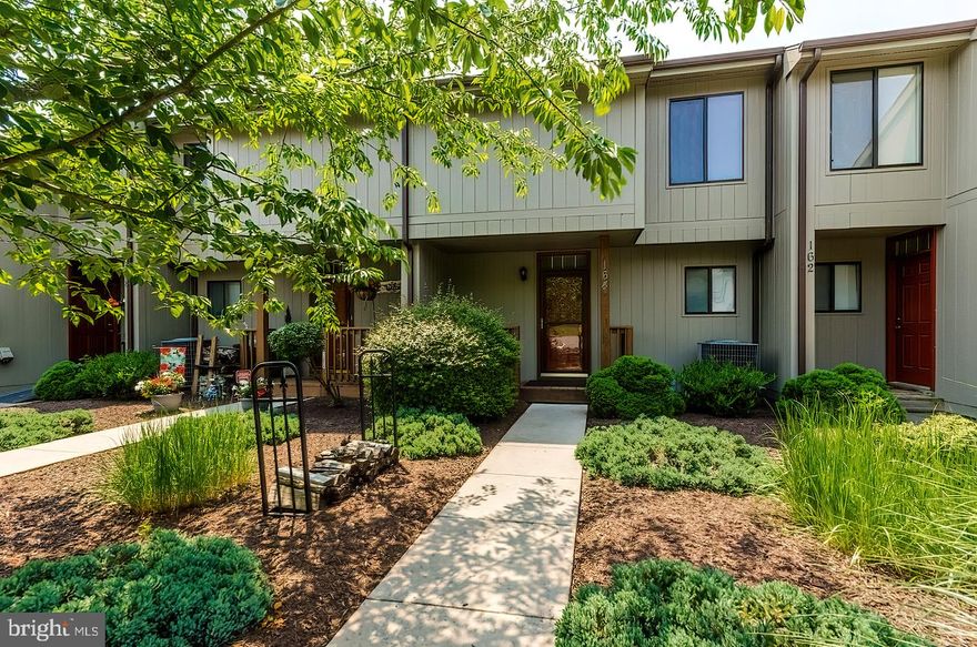 Nestled in the serene Fishhook Cluster of The Woods Resort, this stunning townhouse offers a perfect blend of comfort and elegance, ideal for those seeking a tranquil lifestyle without sacrificing modern conveniences.  Step inside to discover an inviting and open floor plan that seamlessly connects the living and dining areas, enhanced by an abundance of natural light from skylights and a new large sliding glass door. The new luxurious vinyl plank flooring adds a touch of sophistication while ensuring durability for everyday living. Gather around the cozy wood fireplace that rests against a stone designer wall, complete with glass doors and a charming mantel, perfect for creating lasting memories. The heart of the home is undoubtedly the well-appointed kitchen, featuring new stainless steel appliances, including a self-cleaning oven and dishwasher, making meal prep a breeze. The combination of functionality and style is evident, with ample granite counter space and storage to accommodate all your culinary adventures. After a long day, retreat to the spacious primary suite where relaxation awaits. Indulge in the spa-like primary bath, complete with an oversized soaking/jetted tub, and a walk-in shower, or step out onto the Romeo and Juliet balcony to view the starry sky; the primary suite provides a serene escape after a long day. An ensuite and upper level laundry complete the upper level of the home. Venture downstairs to the fully finished lower level with 2 additional bedrooms, a versatile space perfect for a home office or entertainment area. With a walkout entrance and windows that invite natural light, this area expands your living space and enhances your lifestyle. The large screened porch is perfect for enjoying lazy days, gazing out over the lake, rain showers or quiet evenings; it's truly a space where you can breathe deep and relax. Outside, enjoy the community tennis courts, perfect for active living. The extensive hardscape with the well-maintained exterior, lighting and sidewalks create a welcoming atmosphere.  This is a home that offers both tranquility and accessibility, this townhouse is a rare find. The Woods Resort Class B Membership is available and makes accessible 2 outdoor pools, 1 indoor pool, fitness center, indoor and outdoor tennis, pickle ball and basketball courts, indoor racquetball court. Outside of the available membership, enjoy 2 public golf courses and Sleepy Creek Spa. Experience the charm of The Woods Resort and make this beautiful property your new primary home, vacation or investment home. With new windows, sliding doors, whole house paint, flooring, appliances, lighting, fans, and more, there's nothing for you to do but relax!  Don’t miss the opportunity to embrace a lifestyle of ease and elegance!