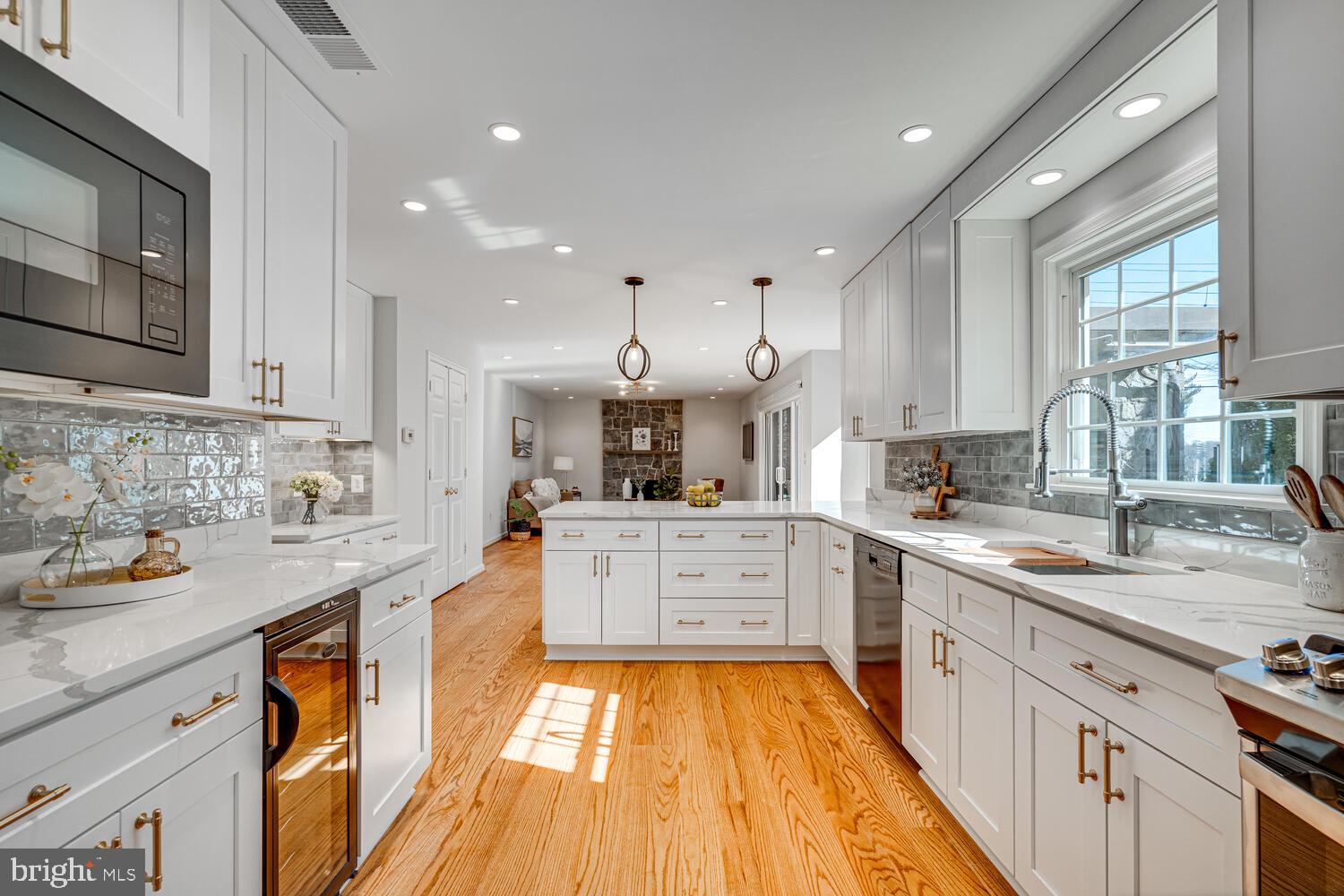 Welcome to refined family living in the heart of McLean. Tucked away on a quiet cul-de-sac, this luxurious 5-bedroom single-family home offers the perfect blend of elegance, comfort, and practicality—designed with modern family life in mind.
The main level features a bright, open-concept layout anchored by a sleek, modern kitchen outfitted with high-end stainless steel appliances and ample space for family meals and gatherings. The adjoining living room, complete with a cozy fireplace, creates a warm and welcoming atmosphere. Step outside to a beautifully designed heated patio with a fully functional outdoor kitchenette—perfect for year-round entertaining and weekend cookouts.
Upstairs, four spacious bedrooms provide room for everyone, while a centrally located laundry area adds everyday convenience. The primary suite serves as a peaceful retreat with a generous walk-in closet and a spa-inspired ensuite bath, offering the perfect place to unwind.
The fully finished lower level expands the living space with a versatile recreation room, a full bath, and a secondary laundry area—ideal for guests, play, or a home gym.
Located in the prestigious McLean community and zoned for top-rated public and private schools, this home combines luxury living with family-friendly amenities. With its exceptional layout, high-end finishes, and unbeatable location, this is a rare opportunity to enjoy the best of Northern Virginia living.
Welcome home to a lifestyle of comfort, convenience, and elevated family living..