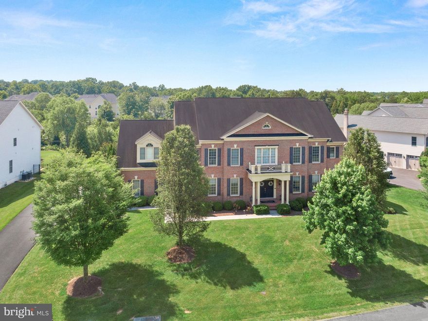JUST LISTED! Step into a one-of-a-kind luxury residence in this beloved Village of Waxpool home with SALTWATER POOL on .64 Acres!  *Briar Woods High School Pyramid* With high-end renovations completed between 2019 and 2021, this spectacular North-facing home offers refined style and unparalleled functionality—featuring 6 spacious bedrooms, each with its own private ensuite full bathroom, plus an additional 7th full bath in the fabulous lower-level and 2 half-baths on the main level for luxury and convenience!  The expanded chef’s kitchen, showcasing a brand-new refrigerator (2024), extra-large center island, granite countertops, under-cabinet lighting, freshly painted cabinetry, designer backsplash, and premium fixtures. The adjacent mudroom and family welcome center is a standout feature—custom-designed for everyday ease!
A 2022 family room renovation introduced elegant, coffered ceilings and a custom wood-burning fireplace, blending comfort with timeless craftsmanship. The laundry room was fully remodeled and expanded in 2022, now featuring additional space, custom design, and added natural light with a new window. The lower level is a masterclass in luxury living, with a complete basement remodel (2019) including a custom bar with beverage fridges and ice maker, a climate-controlled wine cellar with glass viewing window, full gym with windows, game room, fireplace, full bath, and two oversized storage rooms.

In 2021, the backyard underwent a $300K+ transformation into a private outdoor retreat. Entertain effortlessly with a 20x40 diving-depth saltwater POOL, custom hot tub, expansive Techo Bloc decking, custom built gas firepit, multiple seating zones, lush soft scaping, and two ready-to-plant garden beds. The lighted Trex deck adds charm and functionality for evening gatherings. An irrigation system keeps the landscaping lush, while exterior lighting in both the front and back enhances the home’s curb appeal and outdoor ambiance. A fenced backyard ensures privacy and safety, making this the perfect retreat for family and guests alike.
This home is also outfitted with state-of-the-art technology and comfort systems. A comprehensive ADT security system includes heat and water sensors, while an exterior camera surveillance system offers peace of mind. A whole-home Sonos speaker system provides seamless audio throughout, and a Nest front doorbell adds convenience and security. In 2018/2019, four brand-new premium Carrier HVAC systems, a whole-home humidifier system, and a whole-home water filtration and softener system were added for optimal air and water quality. In 2023, the home’s water heater was replaced.
Additional highlights include four gas fireplaces and one wood-burning fireplace, a three-car garage with custom built-in storage and storage areas in second office/bedroom. You’ll love the custom window treatments, wood shutters and keyless entry on all doors. The oversized main-floor office offers flexibility for a second workspace, and custom closets in the bedrooms include thoughtful touches like extra linen storage. An upper-level “fourth floor” suite serves as the perfect guest hideaway, teen retreat, or home office. Designer-selected paint colors and lighting throughout.  All of this PLUS a 1 Year Home Buyer Warranty!!
*Award-winning schools* Briar Woods HS / Eagle Ridge MS / Mill Run ES. Close to all major commuter routes, schools, dining, medical buildings, shopping, INOVA Loudoun Hospital, Dulles Airport, Dulles Greenway, Rt. 28 and Rt. 7. Only 2 miles to Silver Line Metro.  This exceptional home blends thoughtful updates, timeless luxury, and everyday practicality—delivering a move-in-ready lifestyle that’s truly unmatched.  COME SEE!