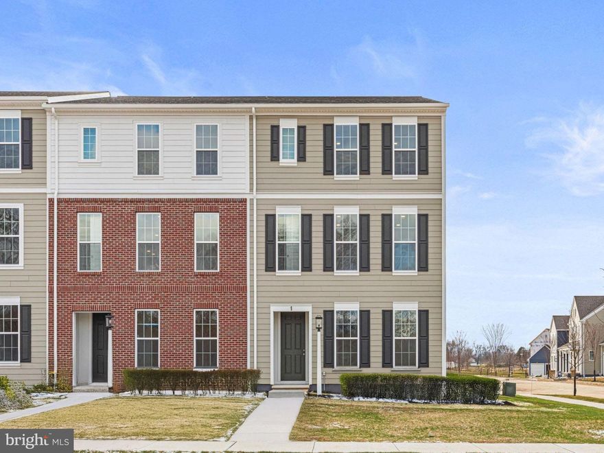 Welcome home to a move-in ready end townhome where modern design meets everyday convenience—all within the highly ranked Cumberland Valley School District. Perfectly placed near neighborhood green space, this home extends your living outdoors with a private front courtyard and open lawn just steps from your door—ideal for morning coffee, picnics, or an impromptu game of catch. Inside, the kitchen makes a bold statement with rich rye-stained cabinetry paired with a sage green island, accented by quartz countertops and a designer tile backsplash. Luxury vinyl plank flooring flows throughout the main level, connecting a light-filled great room to spaces designed for gathering and entertaining. Upstairs, a serene primary suite with walk-in closet and spa-inspired bath offers the perfect retreat, while two additional bedrooms and a full bath provide room for everyone. A finished lower-level game room—complete with a separate work-from-home space—adds flexibility for play, productivity, or relaxation. With a two-car garage, low-maintenance living, and move-in ready, this is more than a home—it’s a lifestyle upgrade waiting for you in Grange. Grange features preserved spaces including a wildflower meadow, green areas shaded by century-old trees, walking trails, and gathering spots perfect for connecting with friends old and new.