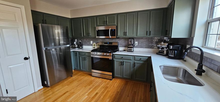 This very  well maintained home is ready to be yours! Leesburg 3 level brick front townhome with one car garage in sought after Greenway Farms. 3 bedroom 2 full bathroom and 2 half bathrooms. hardwood floors throughout with a spacious living room/ dining room combination filled with natural light. The open and bright kitchen with breakfast area with beautiful quartz countertops. Slider from the kitchen opens to a large deck overlooking the common area. Upper level features 3 bedrooms and 2 full baths. Primary bedroom is oversized with 2 walk in closets and a remodeled primary bathroom. Hardwoods throughout the top floor. Lower level features a rec/family room with gas fireplace and sliders that open to a fully fenced backyard with a patio. All of this, and only 2 miles to the heart of historic downtown Leesburg! Recent updates include: Brand New  HVAC  & Water Heater  before .  Roof (2020),  Master Bathroom  (2022)   Kitchen appliances  (2022)  All toilets  and bathroom faucets  replaced (2022) New  carpet  in staircase.