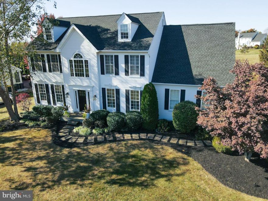 Welcome to 5416 Windtree Drive, an inviting and spacious home offering a comfortable living environment with
elegant design. Located within the highly desirable Windtree community within the coveted Central Bucks
School District, and just minutes from the center of Doylestown. The main level includes a formal living room
and formal dining room with wainscoting, crown molding, both with plantation shutters. The entire first and
second floors of this residence (with exception of 2 bathrooms and laundry room) are finished with stunning
acacia wood flooring, known for its natural wood grain and distinct beauty. The gorgeous kitchen boasts top of
the line cabinetry, quartz counters, and Thermador appliances, including 6 burner stove and matching hood,
extra large refrigerator, and dishwasher, along with a Zephyr wine refrigerator. The large center island is
perfect for casual dining, as well as an inviting entertaining space. Adjoining the kitchen is the family room,
which features a gas fireplace. The finished lower level has additional living area with custom built in cabinetry,
a playroom or entertaining space with wet bar and custom shelving, perfect for toy/game storage, along with a
hidden toy chest under the stairs. The lower level also includes a separate room with full bath, perfect for gym,
office, and guest overflow. The second floor features a main primary suite, that includes two walk-in closets,
and large sitting room currently used as an office, and adorned with plantation shutters. The large primary
bath has double bowl vanity, jetted tub and stall shower. Three additional bedrooms, all of generous size, and
a hall bath complete the second floor. An expansive paver patio perfect for outdoor entertaining, accessible
from the kitchen French doors, overlooks the dedicated open space. The owners have loved and cared for this
home since construction and are ready to hand it over to the next buyer who will love it just as much.