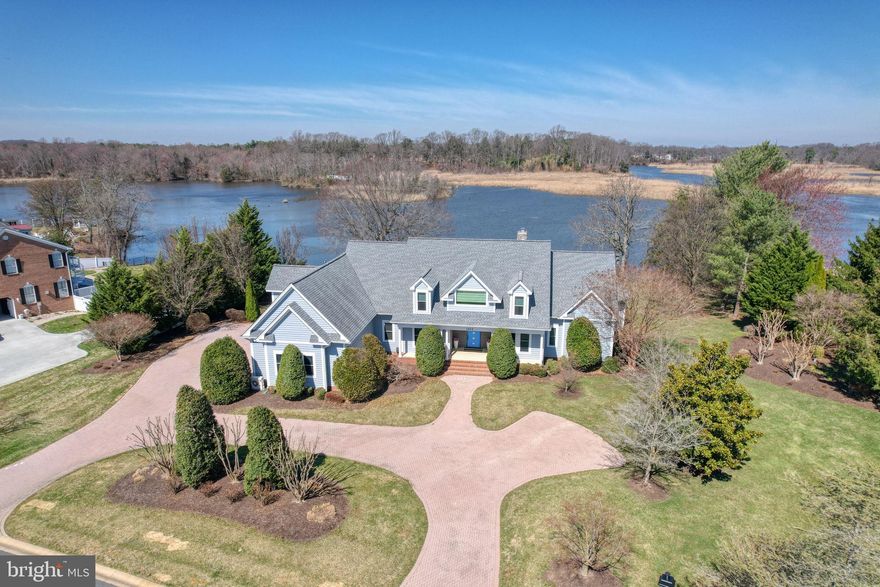 Nestled in one of Kent County's most prestigious waterfront communities, this stunning renovated home greets you with soaring ceilings, oversized windows, and breathtaking water views. The chef's dream kitchen features granite countertops, premium cabinetry, high-end appliances, and a generous center island — perfect for entertaining. The main level offers a luxurious primary suite with backyard and water access, a private office, a great room with gas fireplace, and a flexible dining area. Upstairs, three en-suite bedrooms surround a versatile loft space ideal for a media lounge or secondary living area. Outside, enjoy a heated saltwater gunite pool, hot tub, three-car garage, and an unmatched waterfront setting that truly has to be seen to be believed. This is more than a home — it's a true resort-style retreat. Schedule your tour!