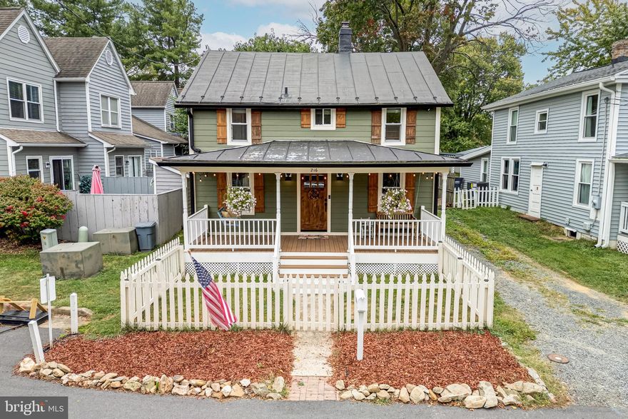 Welcome to 216 W O St. – An incredibly charming home just steps from downtown Purcellville and some of the regions favorite restaurants like Magnolias at the Mill and Monk’s BBQ! Originally built in 1936, the property has been thoughtfully renovated by its owners to meet today’s quality standards without sacrificing its unique character. From the white picket fence to the welcoming front porch where you can sit on the swing and take in the peaceful surroundings and mountain views, as well as the beautiful trees in the backyard that provide ample shade, the home offers a level of serenity rarely found in our area.

The interior of the home is both welcoming and bright, with the main-level featuring comfortable living and dining spaces. The recently renovated kitchen is a highlight with its new appliances, cabinetry and counters. The upper-level features a sizable primary suite with en-suite bath as well as two guestrooms and guest bathroom. A small screened-in porch leads you to the enormous backyard that is a perfect gathering space to spend nights around the firepit. A 20’x10’ shed w/ 60A electrical service adds a tremendous amount of usable storage and workspace.

Recent updates include, but are not limited to: Fiberon composite decking front porch (2019); Installation of vapor barrier and insulation in crawl space (2019); Replacement of all windows and shutters as well as front and rear doors (2020); Removal of all siding/replacement of insulation and new house wrap as well as installation of highly desirable HardiePlank fiber-cement siding (2020); Metal roof treated/repainted (2020); Installation of 20’x10’ shed on concrete slab w/ 60A electrical service, interior and exterior light fixtures and electrical receptacles (2020); Addition of first-floor half-bath (2021); Installed new washer and dryer (2021); Kitchen remodel with new appliances, counters, cabinets and fixtures (2022); New Water Heater (2023); New Air Condenser and Heat Pump (2024); Carpet replaced (2025) and full interior of home painted (2025).

Downtown Purcellville is known for its vibrant community spirit and amenities. Nature lovers will appreciate being surrounded by beautiful landscapes offering endless opportunities for outdoor adventures from hiking trails to scenic parks. For those who prefer more urban pursuits, there are plenty of shopping centers, entertainment venues, and cultural attractions within easy reach.

Whether you're looking for your primary residence or a tranquil weekend retreat, this home offers a blend of comfort, convenience, and charm that is sure to impress any potential homeowner.