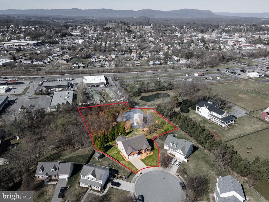 **Charming Ranch with Huge Detached Garage and MOUNTAIN VIEWS!!!**

Discover the perfect blend of comfort and convenience in this immaculate, one-owner ranch-style home boasting 3,781 finished sq ft. With 4 spacious bedrooms and 4.5 bathrooms, this residence offers main-level living at its finest, just one small step into the front door. Complete with a convenient main-level laundry. Making this a dream forever home. 

Enjoy watching beautiful sunsets over the mountain from large back TREX deck. Spacious finished walk-out basement with large den and bedroom with large walk in closet. Large unfinished storage room. 

Set on a generous 1.44-acre lot, you’ll enjoy the tranquility of suburban life while being just a short stroll from shopping and dining options on Main Street. Property features a lovely spring fed creek bringing lots of wildlife sightings. The property features a BRAND NEW ROOF!  

DON'T MISS the 24ftx35ftx16 ft high metal building equipped with 200amp electrical service, 50amp RV outlet and LED lighting , perfect for your hobbies or extra storge. Installed in 2023. Garage has separate entrance from residence, giving you endless opportunities. 

Don’t miss this rare opportunity to own a beautifully maintained home that combines modern amenities with the charm of in-town living. Schedule your private tour today and experience the lifestyle you’ve always dreamed of!