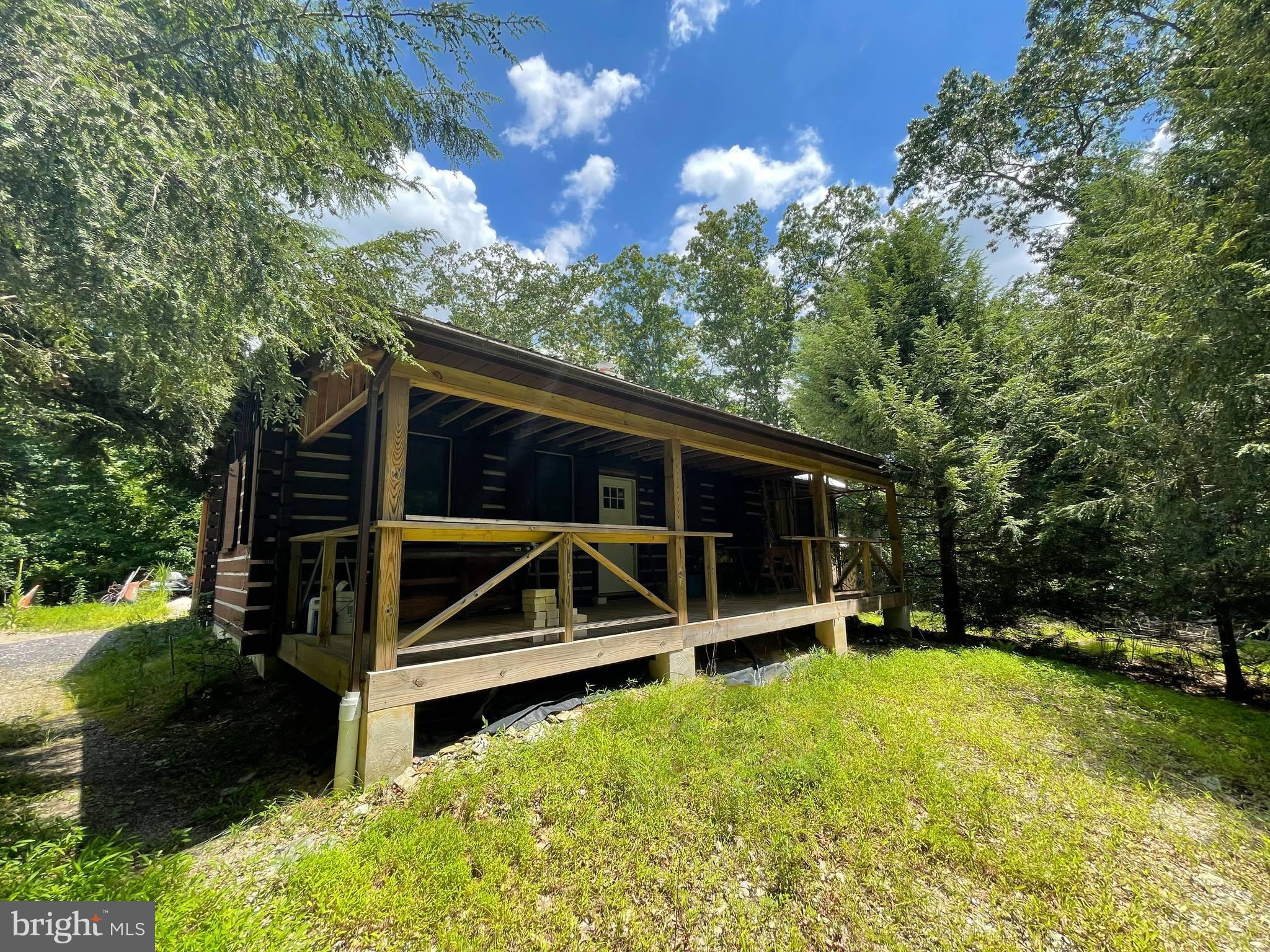 Looking for the rare opportunity to live in a secluded home? You're in luck. This cabin sits at the very end of Chippewa Drive in the private community of Indian Hills and is ready for you to finish it. The home was taken down to the studs and is now poised to have new owners come in and bring your vision to complete this home to fit your needs. Relax on the front porch while you wrap up the day. You've got 3.67 acres that runs back right to Deer Creek and butts up against 47 acres of wooded space. Your very own slice of peace and quiet awaits! Check out the virtual tour to explore the possibilities.