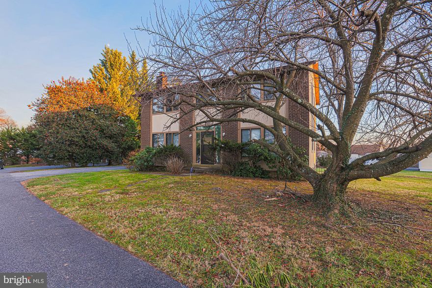 7617 Seven Mile Lane • Pikesville, MD 21208
Set on a generous and level 0.38-acre lot that feels even larger, this 4-bedroom, 2.5-bath colonial offers a
A rare combination of space, privacy, and future potential in one of Pikesville’s most desirable
neighborhoods.
Featuring central air, gas heat, and a traditional layout, the home provides a solid foundation for both
comfortable living and thoughtful upgrades.
The eat-in kitchen includes a charming greenhouse window and opens to a rear deck through sliding glass 
doors, creating an easy flow for entertaining and everyday living.
A main-level den with a fireplace adds warmth and flexibility, while first-floor laundry and a  convenient
laundry chute from the primary bedroom enhances daily functionality.
The full lower level offers a large recreation room with paneling and carpet, plus two additional
rooms, ideal for home offices, hobby space, storage, or future bedroom and bath conversions. Outside access from the lower level to outside stairs.
With room to add a 2+ car garage, expand the rear of the home, or build a two-story addition, this property
offers exceptional long-term possibilities.
Located within walking distance to houses of worship, the setting is both convenient and
private, with easy access to shopping, dining, and major routes. For more information, call LA.