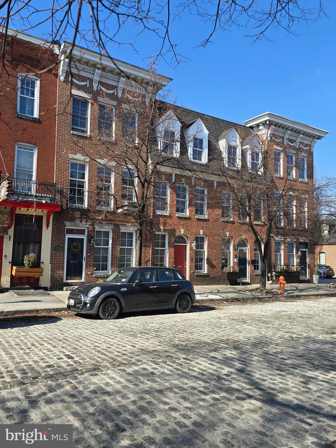 Historic District Federal Townhouse Circa 1795 meets Federal Townhouse Circa 2000. This recently built classic Fells Point townhome is updated to standards of the 21st century. It includes all the ambiance of the colonial era, yet features all the beneficial amenities of today. 2 Primary bedrooms with their own baths, open concept living area, 3 strategically located decks, all wood floors , gas log fireplace and for the modern era, a 1 car attached parking garage. You no longer need to house the horse and wagon at the Livery Stable. A credit score at or above 700 is desired. No smokers please. The property is licensed as a Baltimore City rental. This house is located in the Historic District of Fells Point and is just a block or so from Baltimore's newest 2 waterfront neighborhoods, Harbor East and Harbor Point.