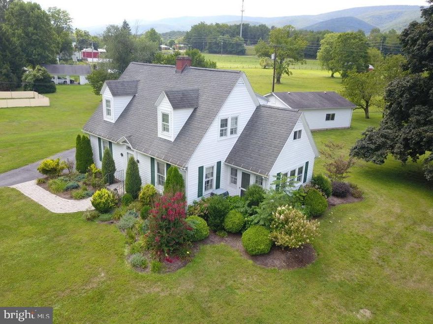 CHARMING 1½ STORY CAPE COD HOME ON 1.64 ACRES.  EXTERIOR OFFERS VNYL SIDING, 35 YEAR SHINGLES, ORIGINAL WINDOWS W STORM WINDOWS, STONE PAVER SIDEWALK, STORM DOOR, ATTRACTIVE LANDSCAPPING, PAVED DRIVEWAY AND 2-CAR GARAGE W AUTO DOOR OPENERS.  MAIN FLOOR INCLUDES FOYER W/TEX WALLS & CEILINGS.  LARGE LIVING ROOM W BRICK FIREPLACE, COZY COMPACT KITCHEN W APPLIANCES, SEPARATE DINING ROOM W/2 CORNDER HUTCHES & FRENCH DOORS, TV/SITTING ROOM W SLATE TILE FLOOR & FULL BATH.  UPPER FLOOR CONSISTS OF (4) BEDROOMS W OAK HARDWOOD FLOORS, FULL BATH W COMMERCIAL CARPETING & DEEP SOAKING TUB. FULL BASEMENT W LAUNDRY AREA (WASHER & DRYER CONVEYS). OTHER AMENITIES: ELECTRIC BB HEAT, RADIATOR HEAT, NEW TRANS FURNACE & AIR CARRIER, CENTRAL AIR, CEILING FAN/LIGHTS, PLENTY OF STORAGE AND MUCH MORE.  PLEASE NOTE: SUBJECT PROPERTY IS IN FLOOD PLAIN. ** $5,000  REBATE