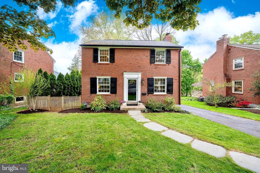 Welcome to 305 Eagle Road, a storybook brick Colonial perfectly located just blocks from the heart of downtown Wayne. From the moment you arrive, this lovingly maintained home feels warm, inviting, and full of charm, offering the ideal blend of classic Main Line character, thoughtful updates, and a walkable Wayne lifestyle. Inside, beautiful hardwood floors run throughout the home, connecting bright and comfortable living spaces designed for everyday living and easy entertaining. The spacious family room is centered by a gas fireplace and flows seamlessly into the dining room, where a charming built-in corner cabinet adds timeless detail. The updated kitchen features granite countertops, stylish cabinetry, hardwood floors, and new stainless steel appliances, including a counter-depth refrigerator. Upstairs, you’ll find three bedrooms and a beautifully appointed full bathroom with an updated vanity, tile, and a glass sliding shower door. Each bedroom offers beautiful hardwood floors, wonderful natural light, and custom built-in closet organizers, while the primary bedroom provides the added benefit of two separate closets and ample space.
The outdoor living space is one of the true highlights of the property. The fully fenced backyard is beautifully landscaped with perennial gardens and offers multiple places to gather, relax, or entertain, including a recently painted rear deck with new railings, a side patio, and a tiered yard with room for play, gardening, and outdoor enjoyment. A detached garage opens conveniently into the backyard, while the charming garden shed with flower boxes serves as a picturesque centerpiece. Additional features include a new HVAC system in 2023, Pella windows, updated exterior motion lighting above the garage, and beautifully maintained gardens surrounding the property. Located in the award-winning Radnor Township School District and just minutes from the Wayne and Strafford train stations, local restaurants, shops, and the beloved Wayne Farmers Market, this home offers both convenience and character in one of the area’s most desirable settings. 305 Eagle Road is a wonderful opportunity to enjoy charm, updates, outdoor space, and walkability in a truly special Wayne location.