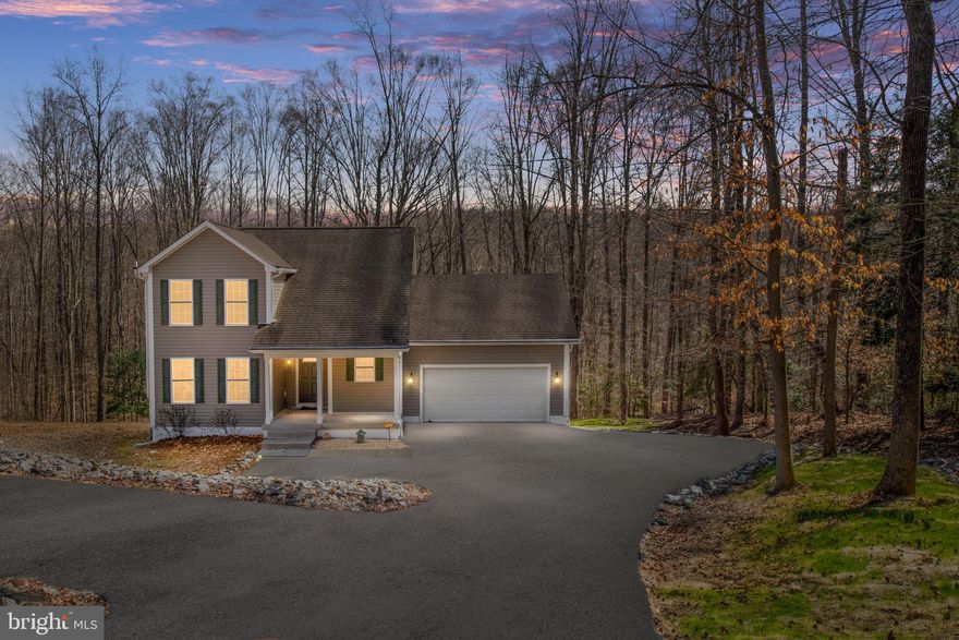 Welcome to this beautifully maintained, private retreat nestled on over 7 acres of peaceful, wooded land, offering the perfect balance of seclusion and convenience with no HOA restrictions. This charming home features 3 spacious bedrooms and 2.5 bathrooms, providing plenty of room for comfortable living. 

As you step inside, you'll immediately appreciate the open and airy feel of the home. The living spaces are thoughtfully designed, with large windows that invite natural light to pour in while offering serene views of the surrounding trees. The kitchen, complete with ample cabinet space, and a dining area is perfect for both everyday meals and entertaining guests. 

The large unfinished walk-out basement is a blank canvas awaiting your vision. With high ceilings and a rough-in for a bathroom, it offers endless potential for customization—whether you envision a game room, home gym, or additional living space. 

Outside, enjoy the expansive, private lot that backs to trees, ensuring total privacy and a tranquil atmosphere. Whether you're hosting gatherings or relaxing in solitude, this home provides an idyllic setting.