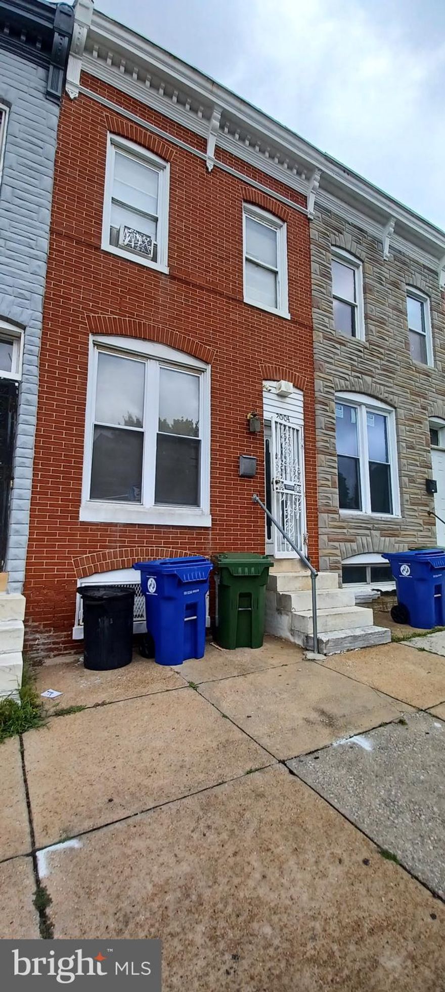 Welcome to this charming interior row/townhouse located in the East Baltimore Midway neighborhood of Baltimore City. Built in 1915, this home features 3 bedrooms and 1.5 bathrooms across two levels. The property includes a connecting stairway and rear entrance basement, constructed with block and brick materials. While it does not have central air, the home is equipped with window units for cooling and 90% forced air heating powered by natural gas. Situated within the Baltimore City Public Schools district, this home is part of a community with easy access to public utilities including public water, public septic, and public sewer services. A notable feature is the long-term Section 8 tenant currently residing in the property, who is willing to continue with the new owner or relocate if not in agreement. This property offers a unique investment opportunity in a well-established neighborhood.