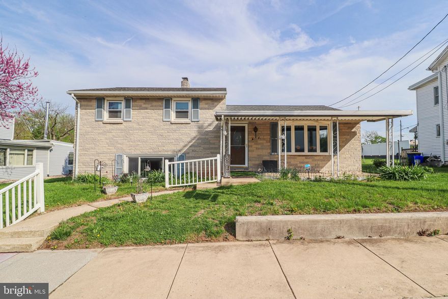 *Newly painted and move in ready!  Located in Northeastern School district, this charming split-level home is ready for its new owners. Upon entry, you're greeted by a cozy family room that flows seamlessly into the kitchen and dining area. The upper level offers three comfortable bedrooms with hardwood floors and a full bathroom. The lower level has a second full bathroom and a generously sized room that can serve as additional living space or fourth bedroom, complete with a fireplace & closet. The lowest level is unfinished, providing ample storage and the potential to be finished for more living space. Just off the dining room, a sliding door opens to a 14x14 carpeted sunroom, that allows you to enjoy the outdoors year-round. The fenced yard provides added security for pets and little ones. A standout feature of this property is the detached garage, which offers four covered parking spaces with overhead storage, four additional driveways spots and ample on-street parking out front. The garage presents rental income potential, as the current owner rents out the space. Brand new water heater installed as of 2020. Located closely to I-83 and Route 30 for commuters and close to John Rudy Park - 181 S Main St. has so much to offer. Schedule your showing today!