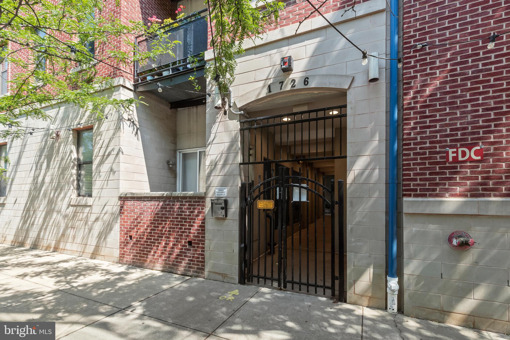 Rarely available and an amazing opportunity to own this beautiful multi-level condo in the heart of Fells Point. Incredible building with a gorgeous green courtyard that has a community grill area, green space and Pond. Just a block from the waterfront and centrally between Fells Point, Harbor East, and Canton, this condo includes gated parking and is minutes from Johns Hopkins, with easy access to I-95 and I-895. Take the elevator to the 4th floor and be greeted by the welcoming blue door that opens to the unit main floor. Here you will find the large kitchen overlooking into the breakfast bar and the large living room with a glass door that leads you to your private deck. A separate area for your computer desk and a half bath can also be found on the main level. The second level offers a primary bedroom suite with walk-in closet, a gorgeous bathroom adorned double vanity and warm-stone ceramic floor tile. The second bedroom is spacious and sunny, with large closets and there is a hall bathroom with a walk-in shower. The laundry room is conveniently located next to the bedroom for your convenience. Third floor stairs leads you to your private rooftop deck where you can watch the panoramic city skyline. It’s a perfect space for relaxing alone or entertaining some friends. Gated parking lot with an assigned parking space makes this a stress-free experience of Fells Point living.