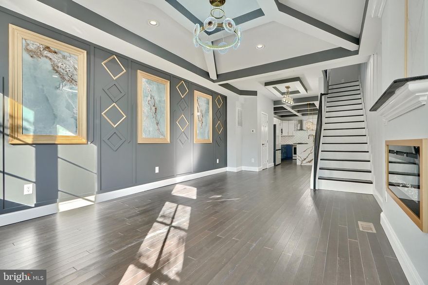 Welcome to 213 S Clinton St! This stunning home boasts beautiful hardwood floors, coffered ceilings, and custom woodwork throughout the main level. Enjoy cozy evenings by the ambiance fireplace in the spacious living area and dinner parties in the dining area. The gourmet kitchen features quartz countertops, a waterfall island, stainless steel appliances, and ample storage, with access to the back patio for easy entertaining. The second level offers a large primary suite with a custom tile ensuite bath and plenty of closet space, as well as a generously sized second bedroom and a hall bath. The finished basement includes another sizable bedroom, a full bath, laundry area, extra living space, and a second patio access. Complete with a 2-car parking pad, this home is just steps away from shopping, restaurants, Patterson Park, and major highways. Don't miss this incredible opportunity to rent his home!