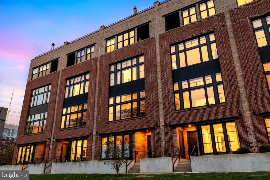 Waterfront luxury meets contemporary elegance in Manayunk's most coveted community. This stunning river-facing residence in The Locks offers approximately 3,680 square feet with 4 bedrooms, 3.5 baths, a lower level flex space and a roof deck with stunning views of the canal and the city. It has been extensively upgraded throughout for turnkey perfection. Premium hardwood floors throughout, and floor-to-ceiling windows with custom dual-opening blackout shades that frame spectacular river views on every floor. The chef's kitchen features top-tier upgrades including soft-close cabinets with custom roll-out drawers, luxurious countertops,  and a complete GE Profile appliance suite. Sophisticated in-ceiling Sonos speakers and recessed lights create the perfect modern living environment. The primary suite boasts a large walk-in closets with a secondary huge walk-in closet adjacent. Thoughtful enhancements continue with an elevator servicing all floors, two-car garage, and professionally installed 220-watt outlet for Level 2 EV charging. The first level includes an enlarged storage closet with custom shelving, and room for a home gym or office.  The rooftop deck features premium Trex flooring—an entertainer's paradise with panoramic river and city views. Steps from the Schuylkill River Trail and just a few minutes walk along the towpath to Manayunk's vibrant Main Street, with its excellent restaurants, bars and boutiques, this meticulously upgraded home offers the perfect blend of waterfront serenity and urban accessibility. Schedule your tour of this rare turnkey masterpiece at one of Philadelphia's most prestigious addresses at a price that can't be beat! Extra bonus, there approximately 4 years remaining of the tax abatement!