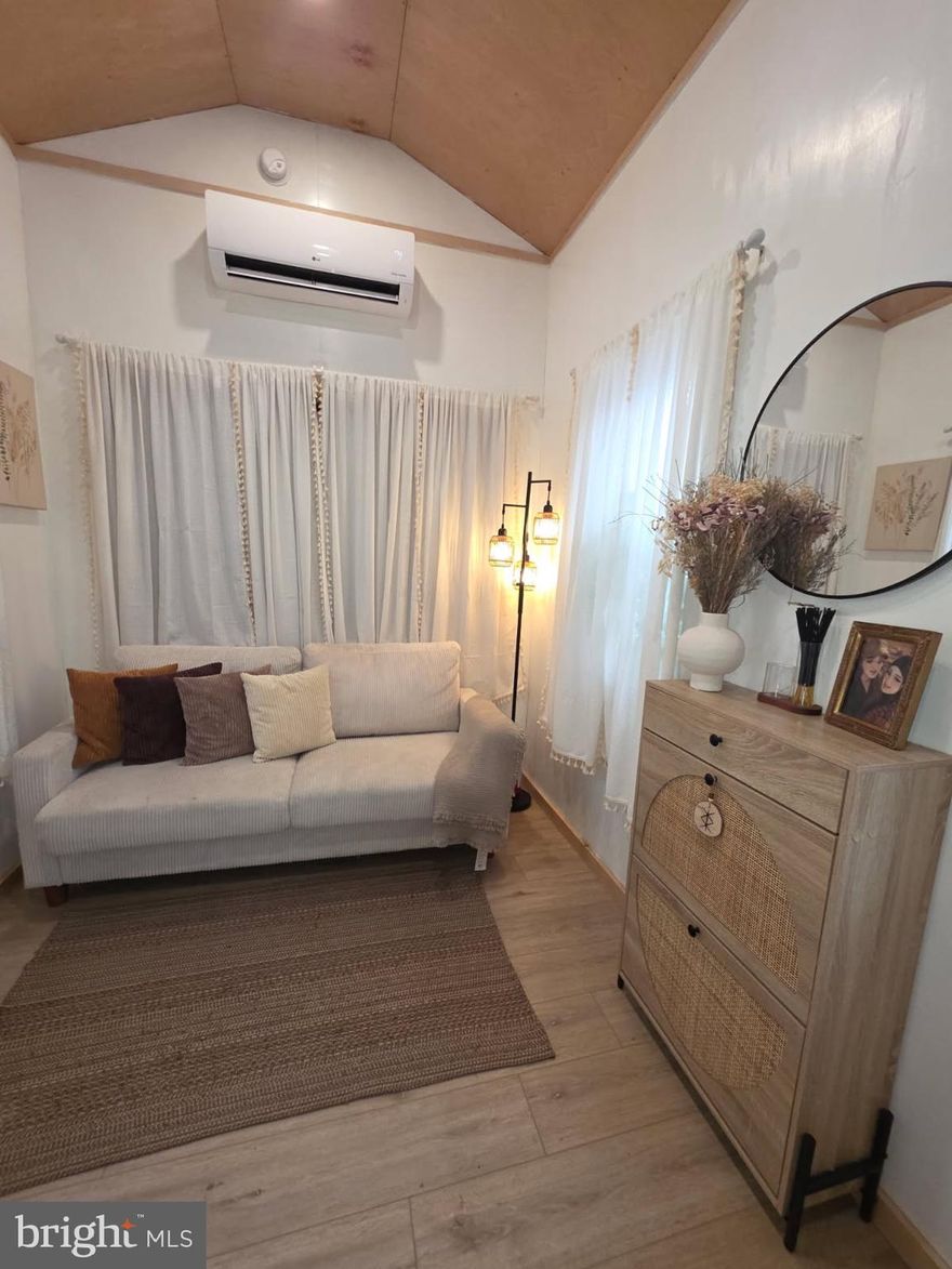 Experience tiny living without sacrificing an ounce of comfort in this nearly-new, masterfully designed retreat. This isn’t your average tiny home; it is a NOAH & ANSI 119.5 Certified home featuring a rare, full-size downstairs bedroom with high ceilings—no climbing ladders to bed here! The double closets allow for lots of storage as well. You’ll find custom upgrades and clever, space-saving finishes that maximize every square inch, complemented by a versatile loft perfect for guests, an at home office, or storage. The full-sized bathroom comes fully equipped, ensuring this home is truly turn-key. The home even has in unit laundry.

Whether you are looking for a permanent sanctuary or a mobile getaway, the flexibility here is unmatched. You can choose to relocate the unit to your dream spot or keep it on-site for a simplified lifestyle. If kept on the lot, the all-inclusive $775/month rent covers water, sewer, electric, propane, internet, trash, mowing and plowing—eliminating the headache of multiple utility bills. Built to the highest safety standards for total peace of mind, this home proves that you can have high-end luxury on a smaller footprint. Schedule your showing today and see how big "tiny" can truly feel!