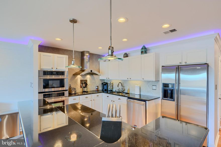 Looking for modern waterfront living ? Look no further! Luxury abounds in this stunning Penthouse condo offers sleek updates, breathtaking views of the Gunpowder River, and your very own private boat slip. Nestled in the peaceful community of Gunpowder Cove, this beautifully renovated home boasts smart technology throughout, including updated electrical wiring to seamlessly integrate with an Alexa home system. With Alexa, you can control everything from room lighting and shades to the two expansive sliding glass doors and the Nest thermostat, all at your fingertips!
Step inside and enjoy the spacious, open floor plan, featuring crown molding, recessed lighting, and ambient accent lighting, all easily controlled via Alexa. Start your mornings with a cup of coffee on the balcony, taking in the stunning southwestern views of the river. The kitchen is a chef's dream with ample granite counter tops, a breakfast bar, and stainless steel appliances, including a dishwasher as well as JENN AIR appliances including the built-in oven, microwave, and refrigerator with an ice maker.
The large primary bedroom is both stylish and functional, featuring a charming ship lap accent wall, fresh paint, a walk-in closet, and a full en-suite bathroom. It's spacious enough to accommodate a king-sized bed, offering plenty of room to unwind. The beautifully updated primary bathroom includes new fixtures, a matching ship lap accent wall, and a modern vanity.
The second bedroom also boasts a lovely ship lap accent wall, fresh paint, and a walk-in closet. The second full bathroom is just outside and features stone accent flooring and crown molding. Additional features of this home include an in-unit washer and dryer and a brand-new BOSCH HVAC (May 2024).

Ready to take your boat out on the water? The sale includes an assigned boat slip, complete with electricity and water, so you can cruise to the vast waters of the Chesapeake Bay in just minutes! Water & Sewer is included in the Condo Assoc. Fee! Seller is motivated, bring your offer! *Transferrable one year warranty included in the sale that the seller just renewed in February*

This one-of-a-kind waterfront condo won't last long—schedule your tour today!