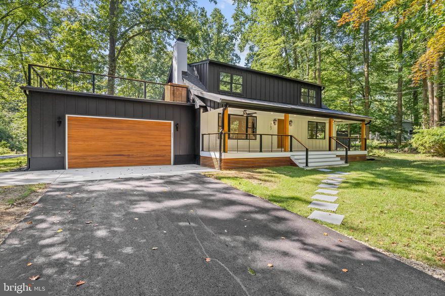 Discover luxurious living in this exceptional 5-bedroom, 4-bathroom home nestled on a full acre in an exclusive water access community. This meticulously crafted residence seamlessly blends elegant design with modern comfort, offering the perfect retreat for those seeking both tranquility and sophistication. The expansive one-acre lot offers endless possibilities for outdoor enjoyment, including gardening, relaxing on the rooftop deck, or sitting under the ceiling fans on the large front porch. Each of the five spacious bedrooms offers comfort and style, while four full bathrooms feature premium tile work, modern vanities, and spa-like amenities. All the while, enjoying the water access community amenities that offer boating, fishing, and waterfront recreation just moments from your doorstep. Easy access to local restaurants, shopping, and major roadways.