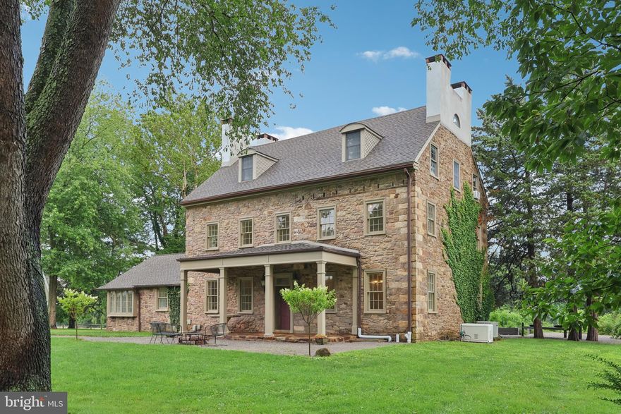 Welcome to Your Private Bucks County Retreat Tucked away on nearly 7 picturesque acres, this stunning Bucks County manor is Doylestown’s best-kept secret. Just minutes from the heart of Doylestown Borough—where you’ll find acclaimed restaurants, museums, parks, theaters, shopping, and convenient access to major transit—this serene estate offers a rare blend of historic charm and modern amenities. The main residence dates back to the early 1700s, with timeless features such as deep window sills, wide plank hardwood floors, intricate millwork, and a classic stone exterior that highlight the home's rich heritage. Thoughtfully updated throughout the years, the manor seamlessly balances elegance and comfort. Inside, the expansive living room is a showstopper, featuring two fireplaces (one working), dazzling chandeliers, and detailed crown moldings. The formal dining room, inviting library, and gracious living spaces offer the perfect backdrop for entertaining or everyday living. The kitchen, expanded in the early 1900s, offers generous space and functionality, while a full bath and laundry room complete the main level. Upstairs, gleaming hardwood floors lead you to four spacious bedrooms and two full baths on the second floor. The third level offers incredible flexibility—ideal as an au pair suite, guest retreat, home office, or entertainment space—with its own bedroom, kitchenette, full bath, and comfortable living area. Step outside to enjoy the tranquil sunroom perfect for relaxing or hosting under the willow trees and open skies. The detached guest house features a private guest home with its own entrance, kitchen, 2 full baths, and hardwood floors—ideal for extended family, guests, or creative studio space. Equestrian or homesteading dreams? The property includes a barn, stable, and equipment shed, ready for animals, hobbies, or even a car collection. Gated fields provide room to roam, ride, or grow. Whether you're envisioning a multigenerational homestead, a country estate, or a secluded weekend escape, this remarkable property offers endless possibilities in one of Bucks County’s most desirable locations.