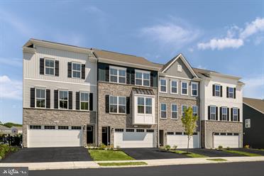 QUICK MOVE-IN END UNIT OVERTURE WITH NOVEMBER DELIVERY AT PENN WEST, new luxury townhomes in Enola, PA, the best value on the West Shore, offering a live-work-play lifestyle, close to modern conveniences and minutes from Camp Hill! You will find thoughtfully crafted 2-car garage townhomes with resort-style facades, in a prime West Shore location and minutes from Camp Hill. Nearby are social opportunities, fitness, recreation, shopping, dining, healthcare and much more. Truly a commuter's dream, Penn West, is centrally located to PA-581, I-83 and I-81, making getting where you need to be quick and easy. This Overture is a townhome for those who value luxury and space. Upon entering the ground level foyer or two-car garage, find a finished rec room and included is the optional powder room. Up the wide staircase, enter the main level where an inviting gourmet kitchen with wall oven and dining space overlook the great room, ideal for entertaining. Natural light fills this space from the rear wall’s sliding glass doors and windows. On the top level, a full bath and convenient laundry sit just outside two spacious bedrooms. Your luxury primary suite includes a stunning walk-in closet, dual vanity bath and bonus Roman shower. Let us show you the value of new construction and forget the costly repairs and maintenance of an older home. We stand by our homes, so included is a new home warranty giving you the peace of mind that you deserve. Host family and friends, enjoy a movie night or kick back and relax at the end of a long day. You’ve worked hard so now you can reward yourself with luxury for less! Purchase a QMI now using seller's preferred lender and receive $15,000 seller assist. Call today to schedule your visit and come home to the Overture and a live-work-play lifestyle! Photos are representative only.